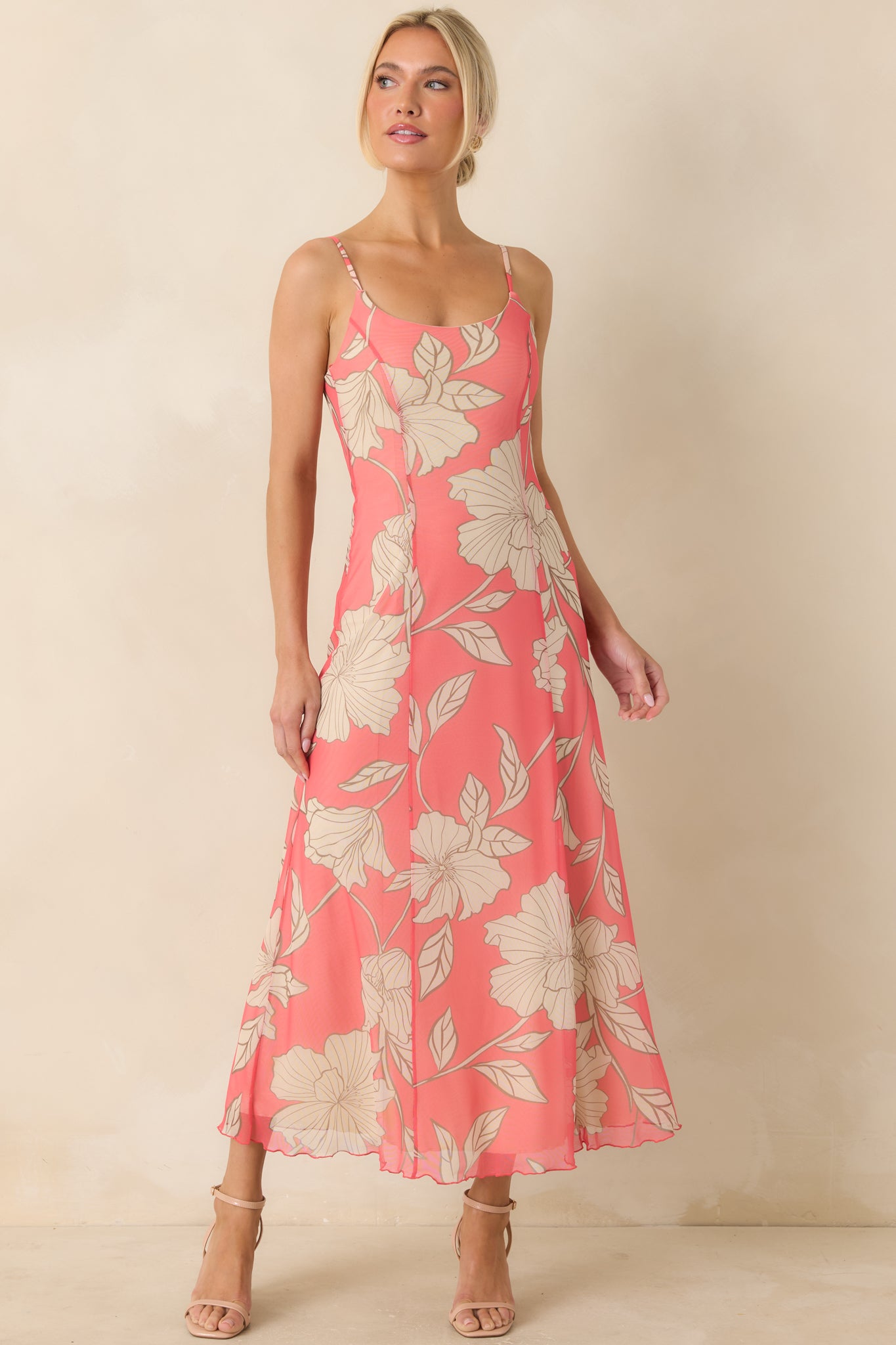 Coral pink midi dress with floral mesh overlay, adjustable spaghetti straps, and a lightweight flowy silhouette.