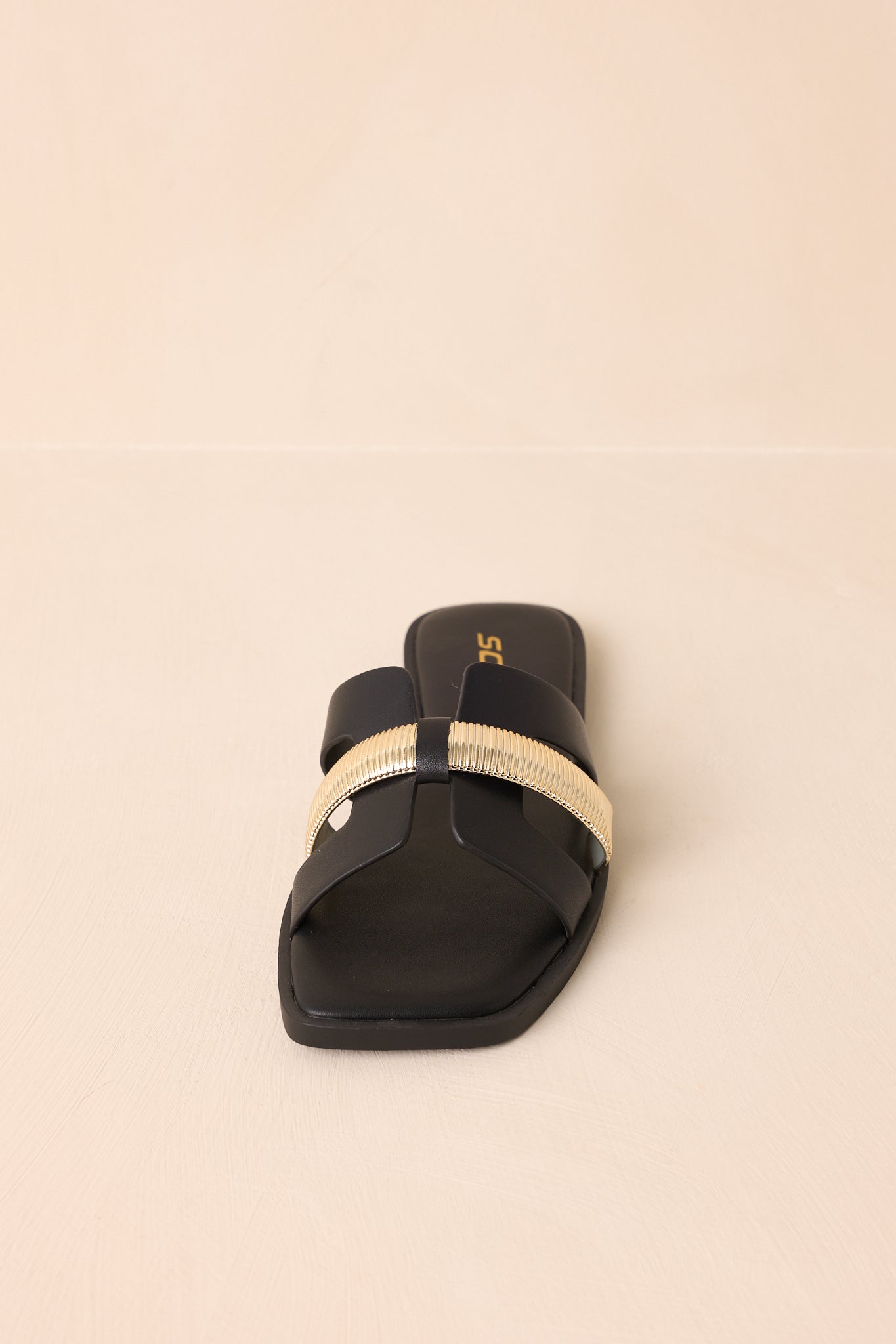 Angled top-down photo showcasing the slide-on entry and gold detail placement.