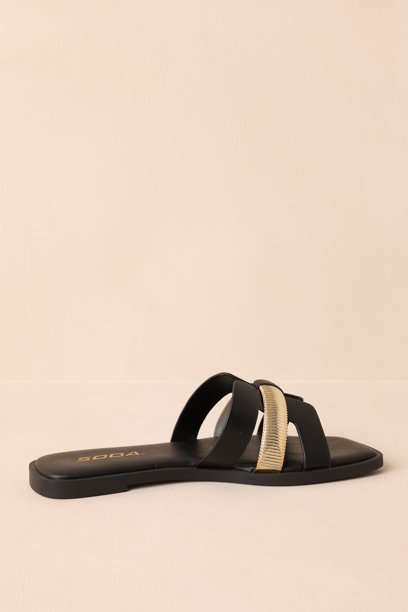 Rear view of the white sandals showing the heel and back cutout structure.