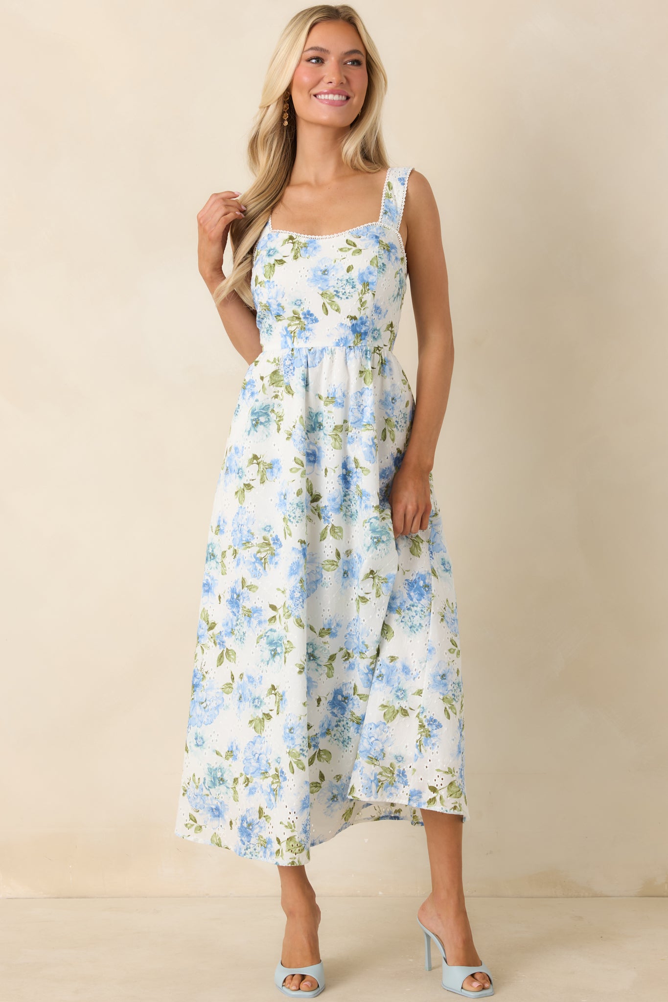 Blue and white midi dress with smocked back panel and lightweight, breathable construction.