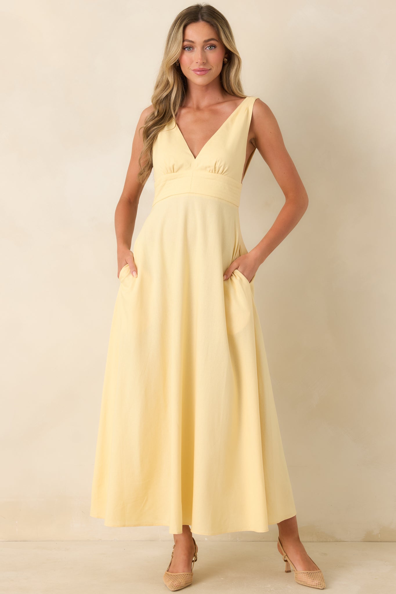 Full skirt midi dress with polished silhouette and hidden side pockets.