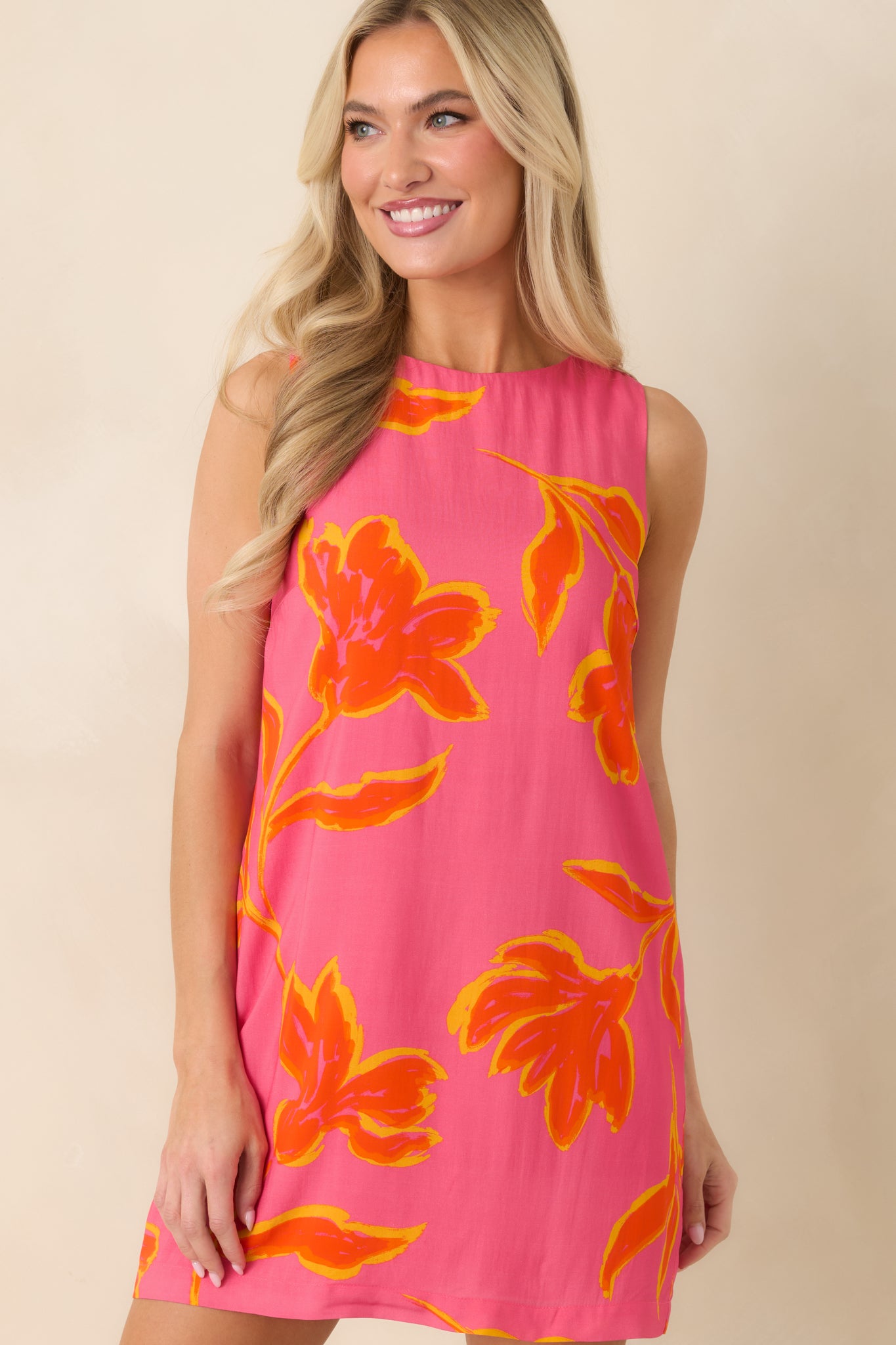 Detailed look at lightweight fabric and striking print on sleeveless shift dress.