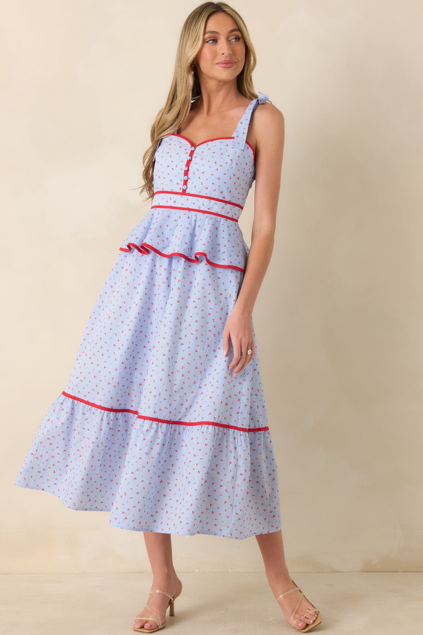 Midi dress with peplum waist detail, structured bodice, and lightweight fully lined fabric.