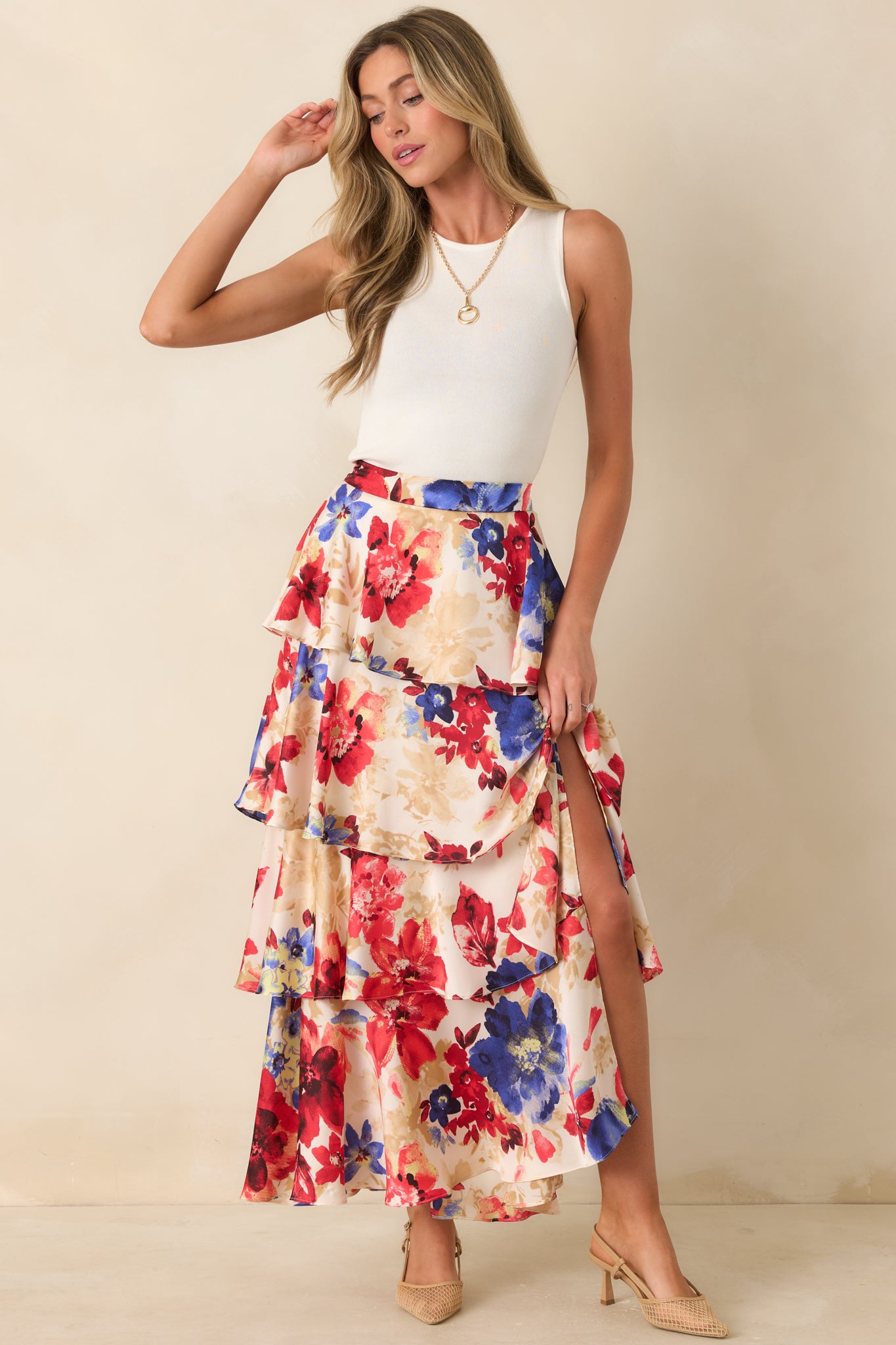Multi floral maxi skirt designed with layered tiers and an easy, breezy drape.