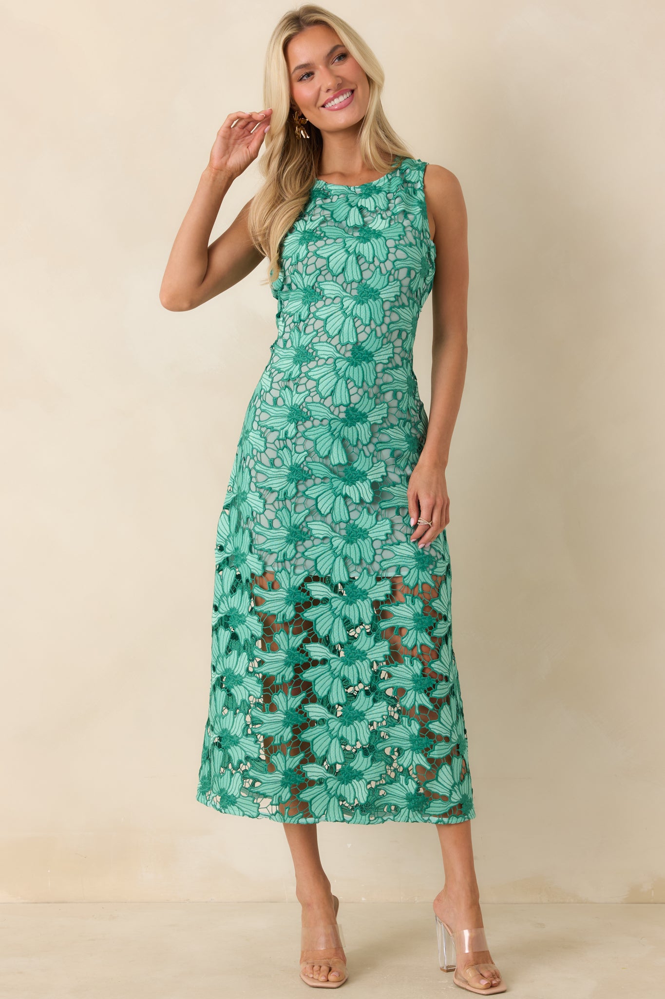 Sophisticated green floral midi dress with clean, tailored fit and lace detailing.