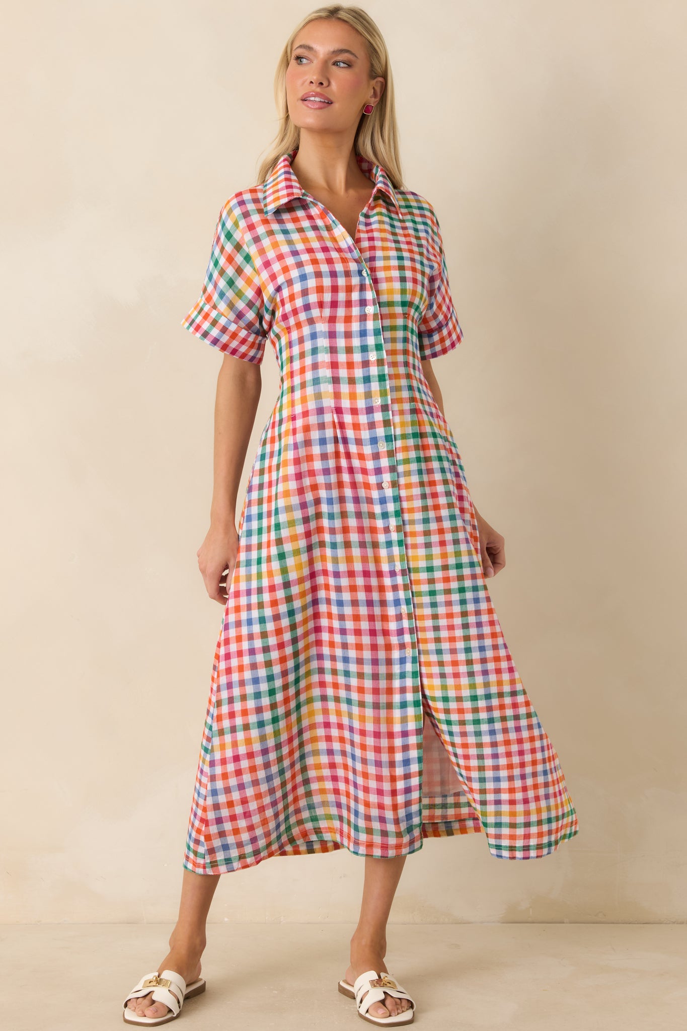 Plaid cotton midi dress featuring short cuffed sleeves, elastic back waist, and relaxed silhouette.