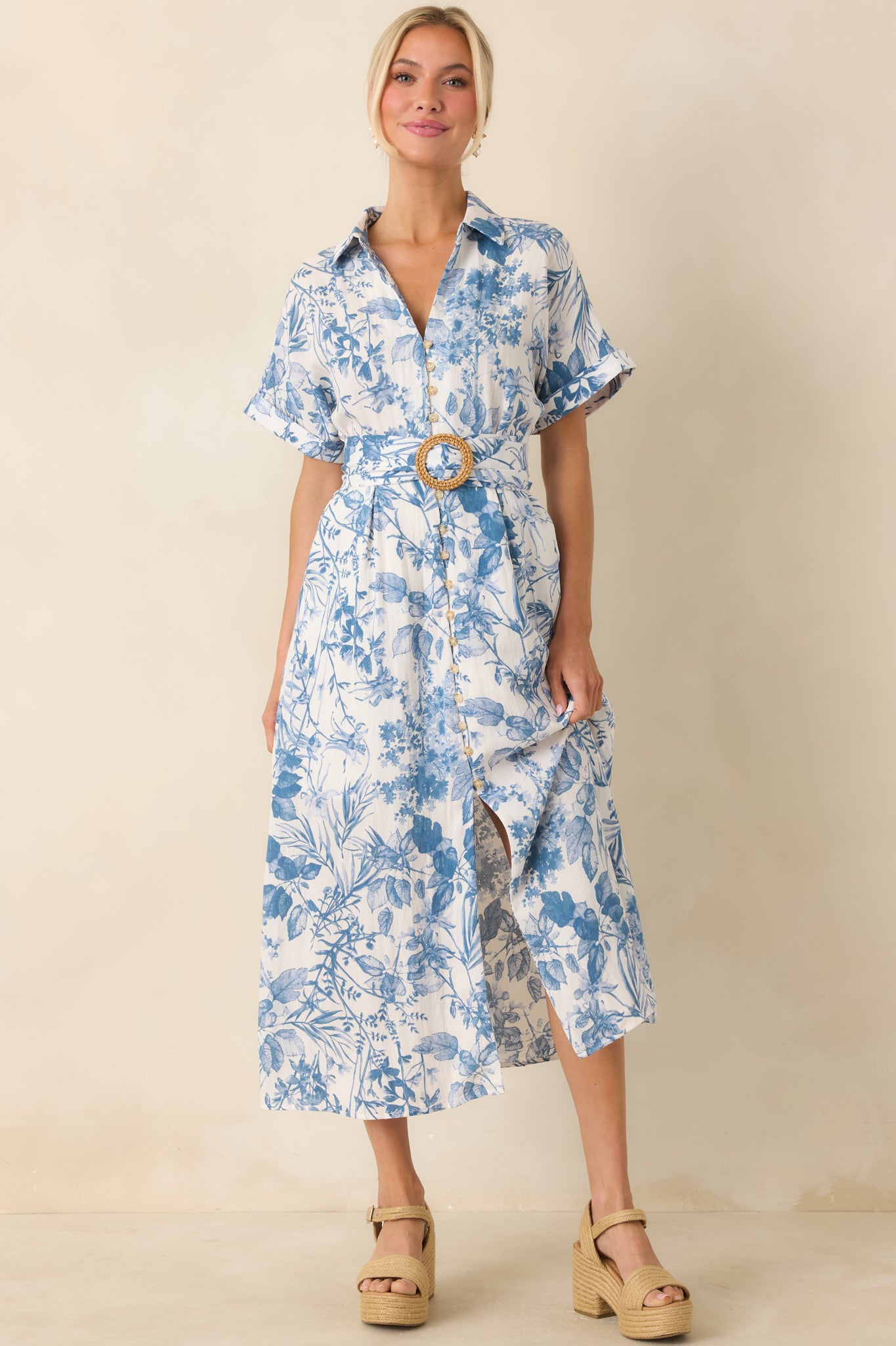 A view of the dress’s collared V-neckline and functional button front, highlighting the structured design and fabric texture.
