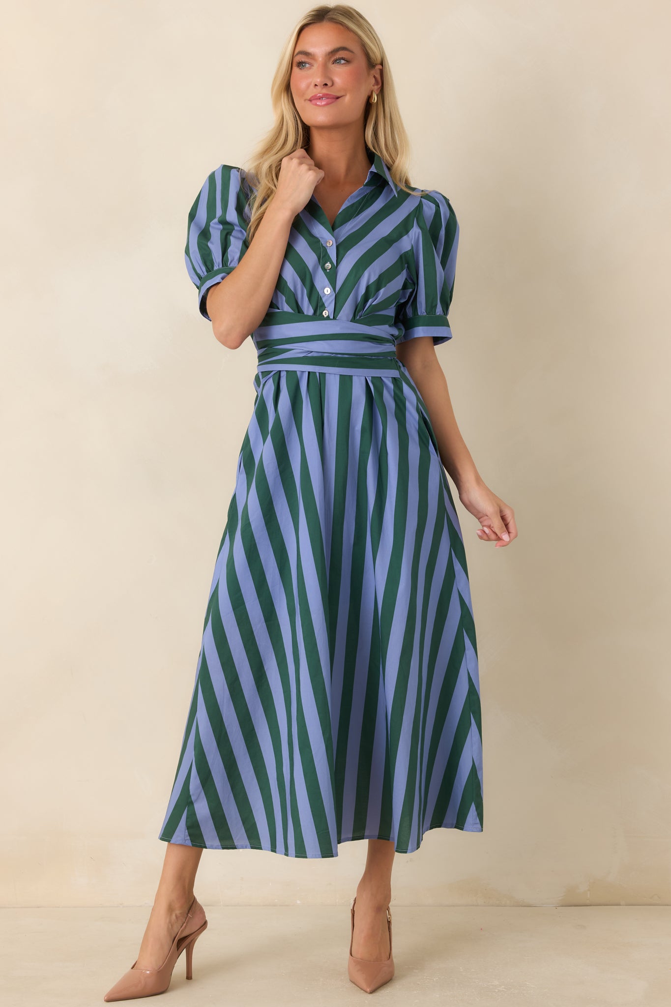 Blue and green striped button-front midi dress featuring a wide self-tie sash that defines the waist, practical side pockets, and a softly lined full skirt for comfortable wear.