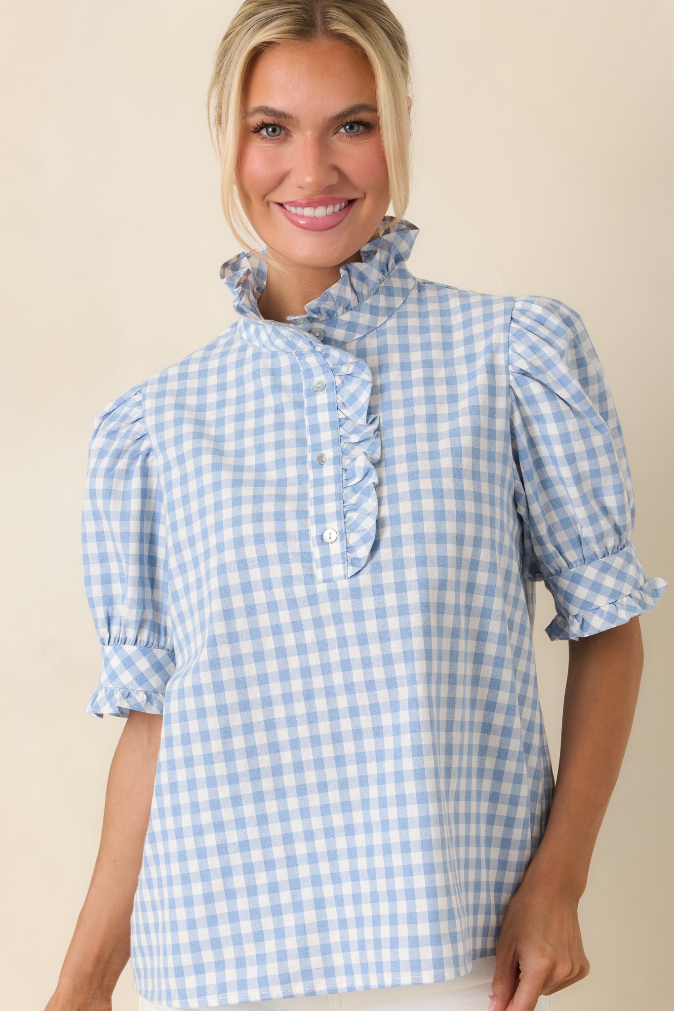 Puff sleeve detail with lightweight cotton texture and relaxed silhouette.