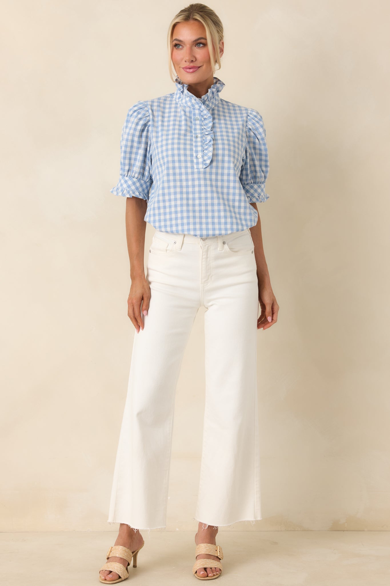 Breezy top with puff sleeves, ruffled placket, and soft lightweight fabric.