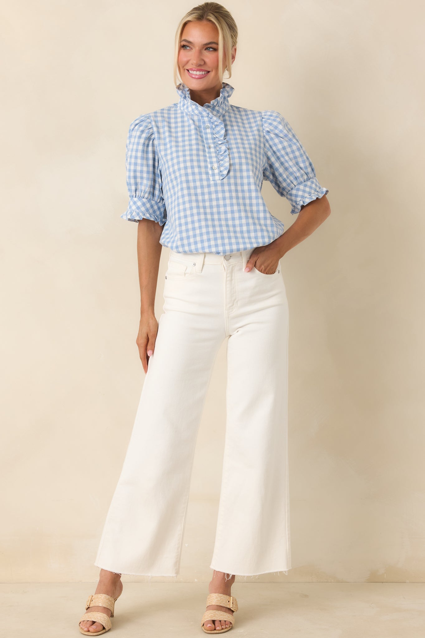 Cotton top with subtle ruffle detailing, relaxed fit, and comfortable silhouette.