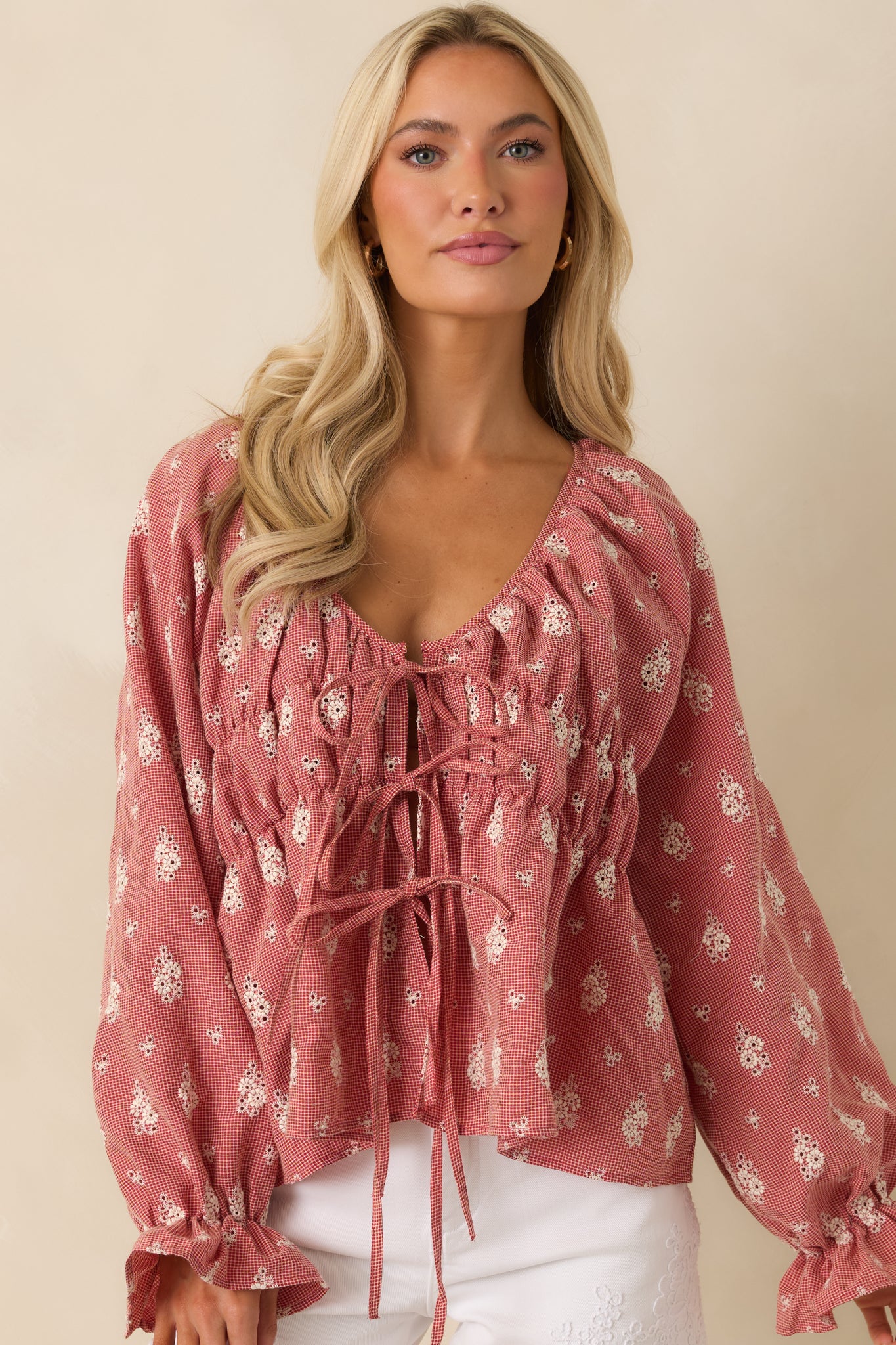 Front close-up showcasing long balloon sleeve volume and soft draping fabric.