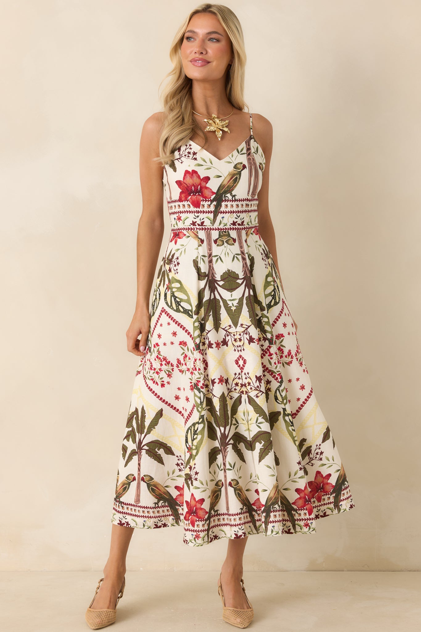 Deep red maxi dress featuring a V-neckline, smooth front silhouette, and concealed back zipper closure.