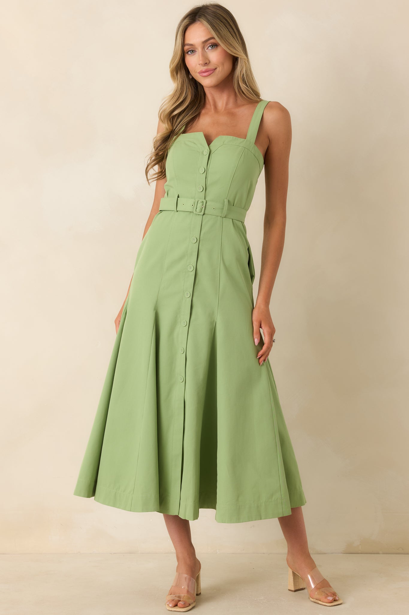 Cotton blend midi dress featuring side pockets and a functional front button design for an easy, everyday look.