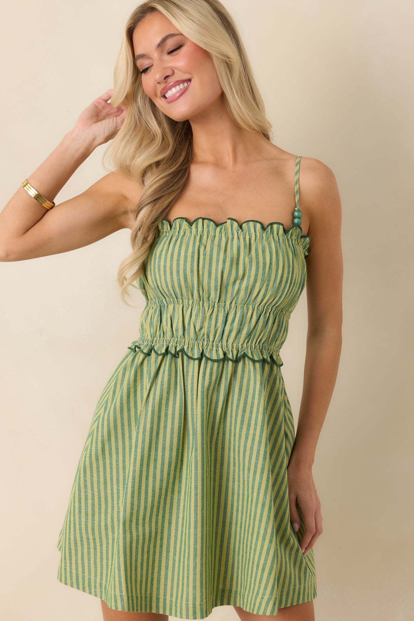 Focused view of shirred bodice and lightweight fabric with gentle structure and movement.