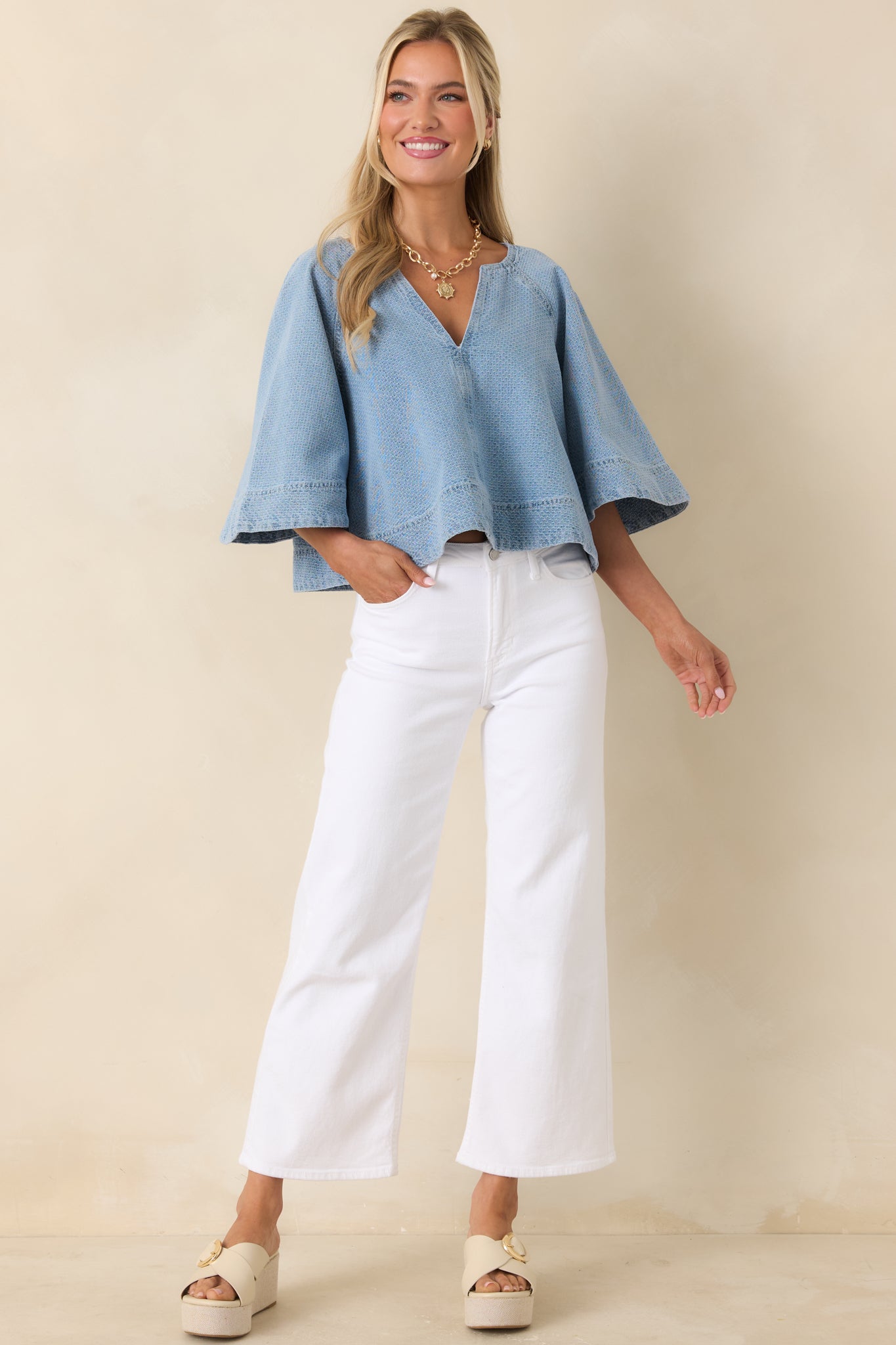 Boxy cotton denim top with airy fit and slightly cropped hemline.