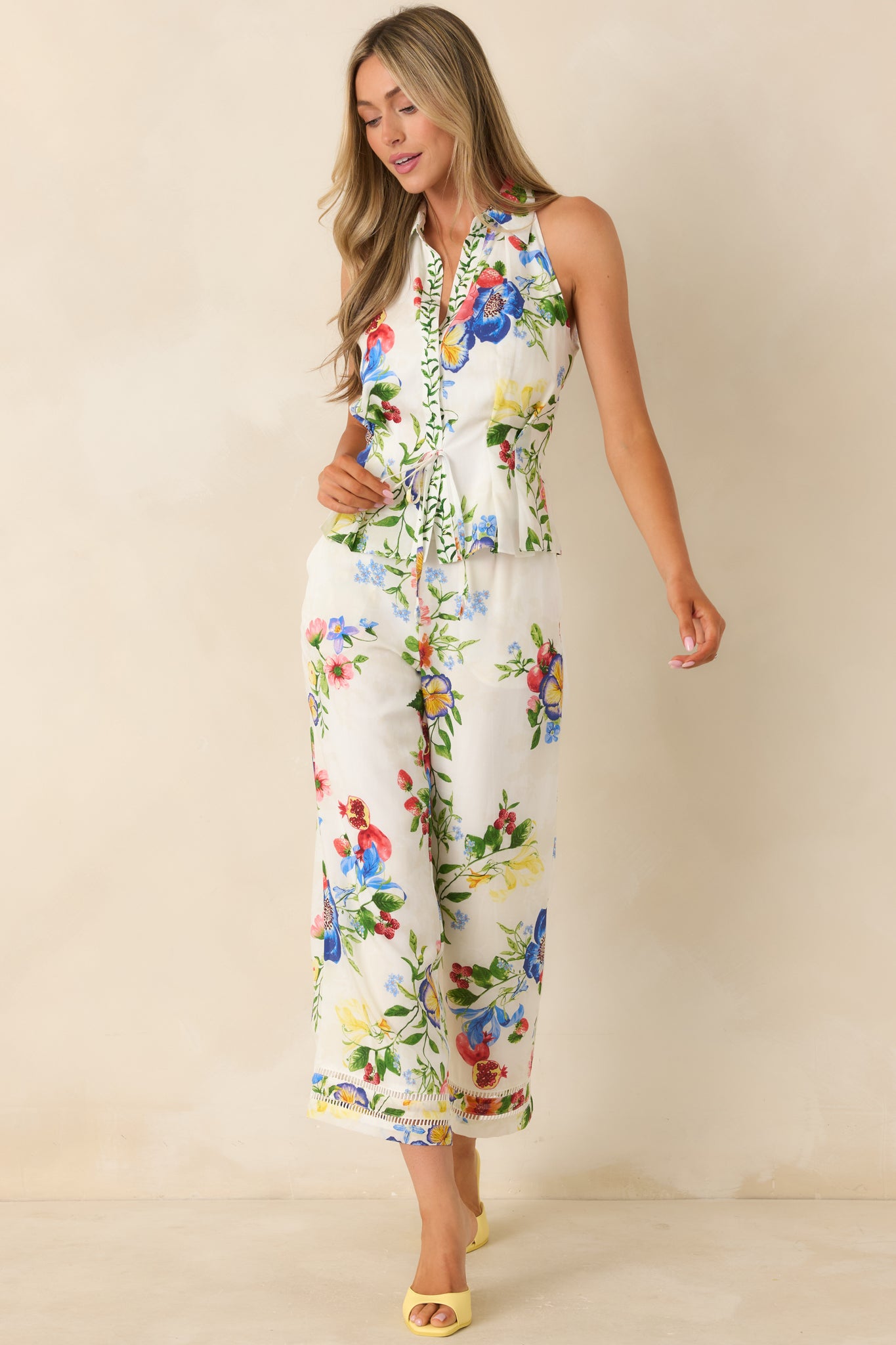 Vibrant floral patterned pants featuring wide leg cut and lightweight lyocell-linen blend.