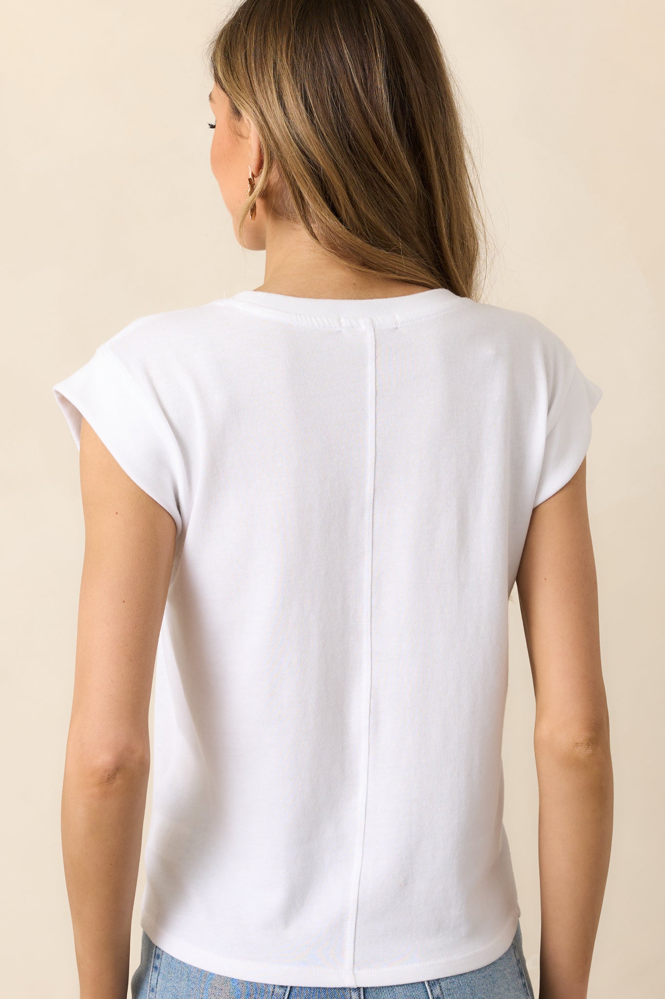 The back of the tee features a simple, clean design, with the soft fabric and relaxed fit continuing throughout.