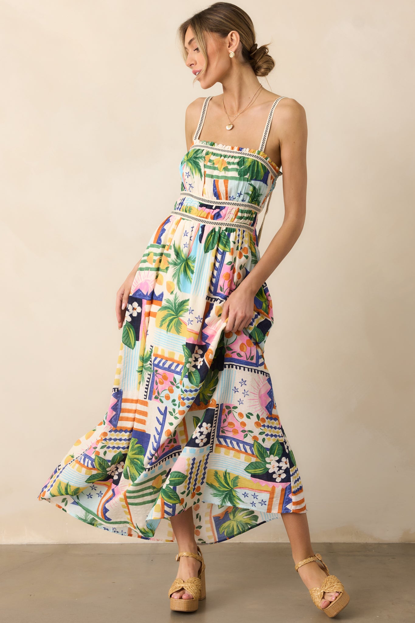 A front-facing angled view, showcasing the movement of the fabric and the unique tropical pattern.