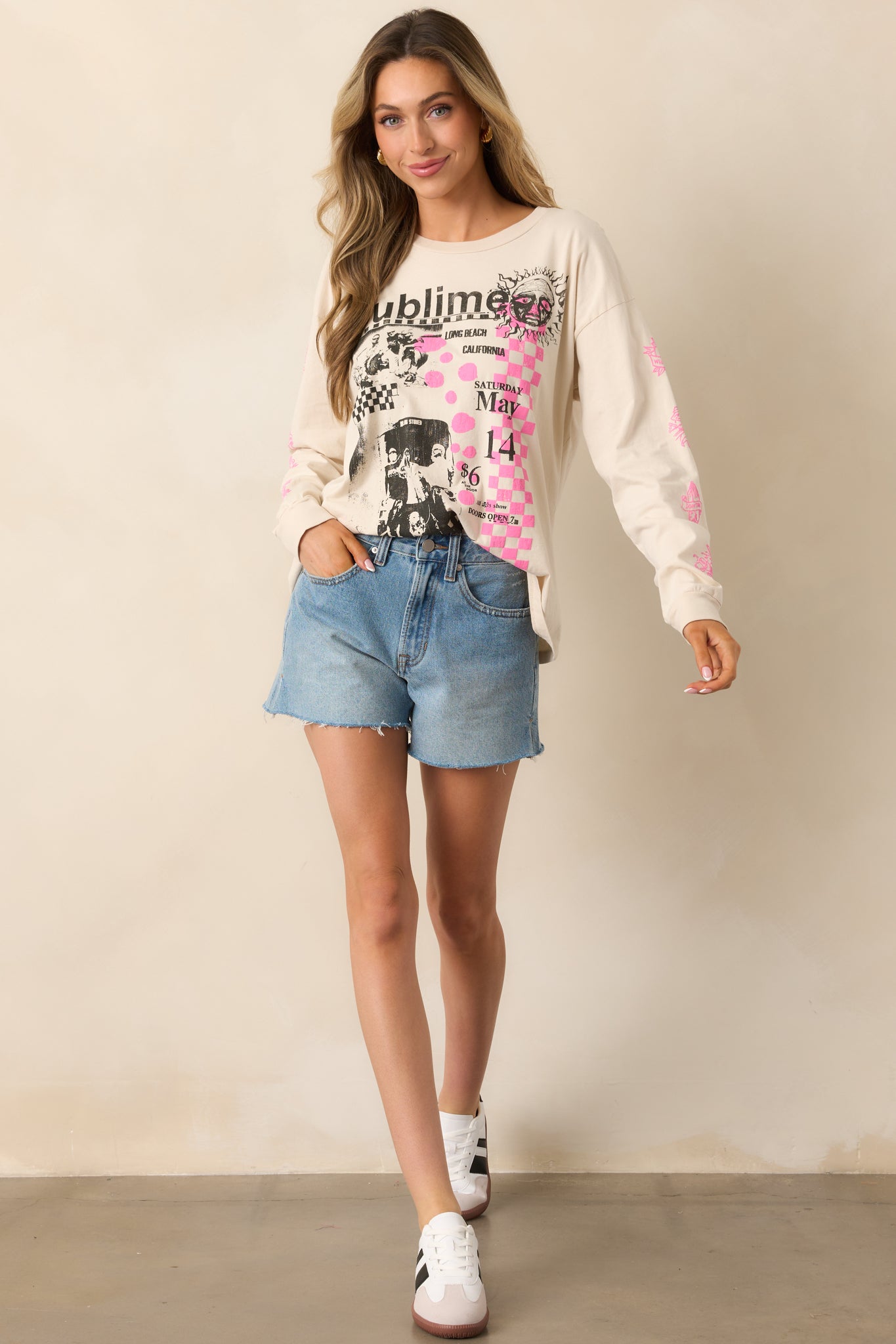 This white tee showcases iconic Sublime track names alongside black and white photos of the members, accented by a checkered pink puff ink print, with long sleeves and ribbed hemlines.