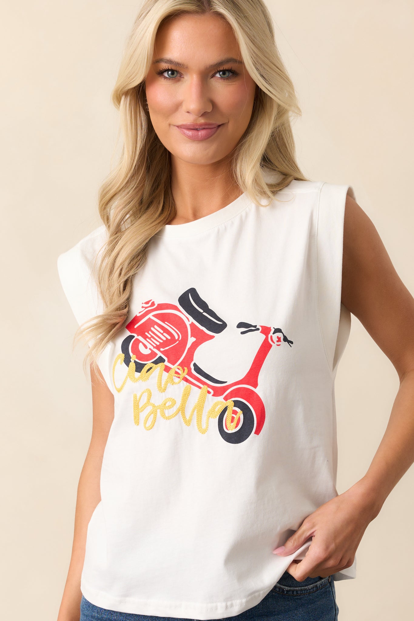 The crew neckline and upper portion of the tee, showing off the crisp white fabric and embroidered detail.