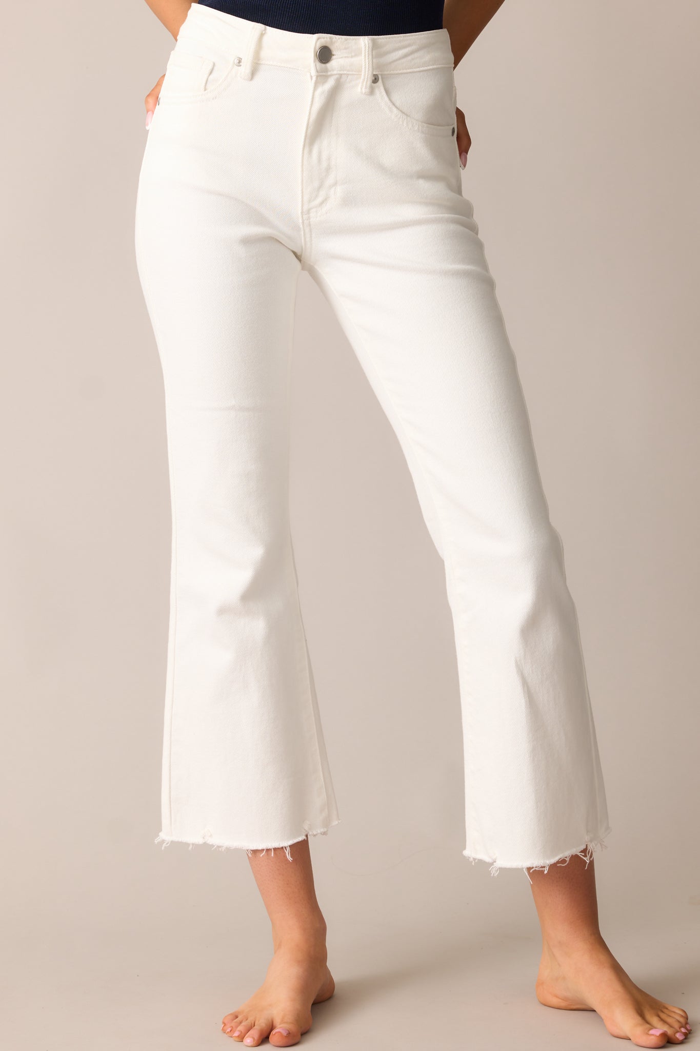 Cropped image highlighting the high rise fit and front pocket detailing.