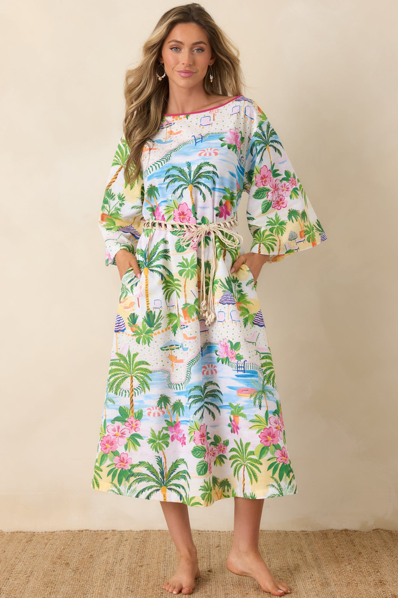 Breezy caftan featuring adjustable drawstring waist and lively poolside-inspired print.