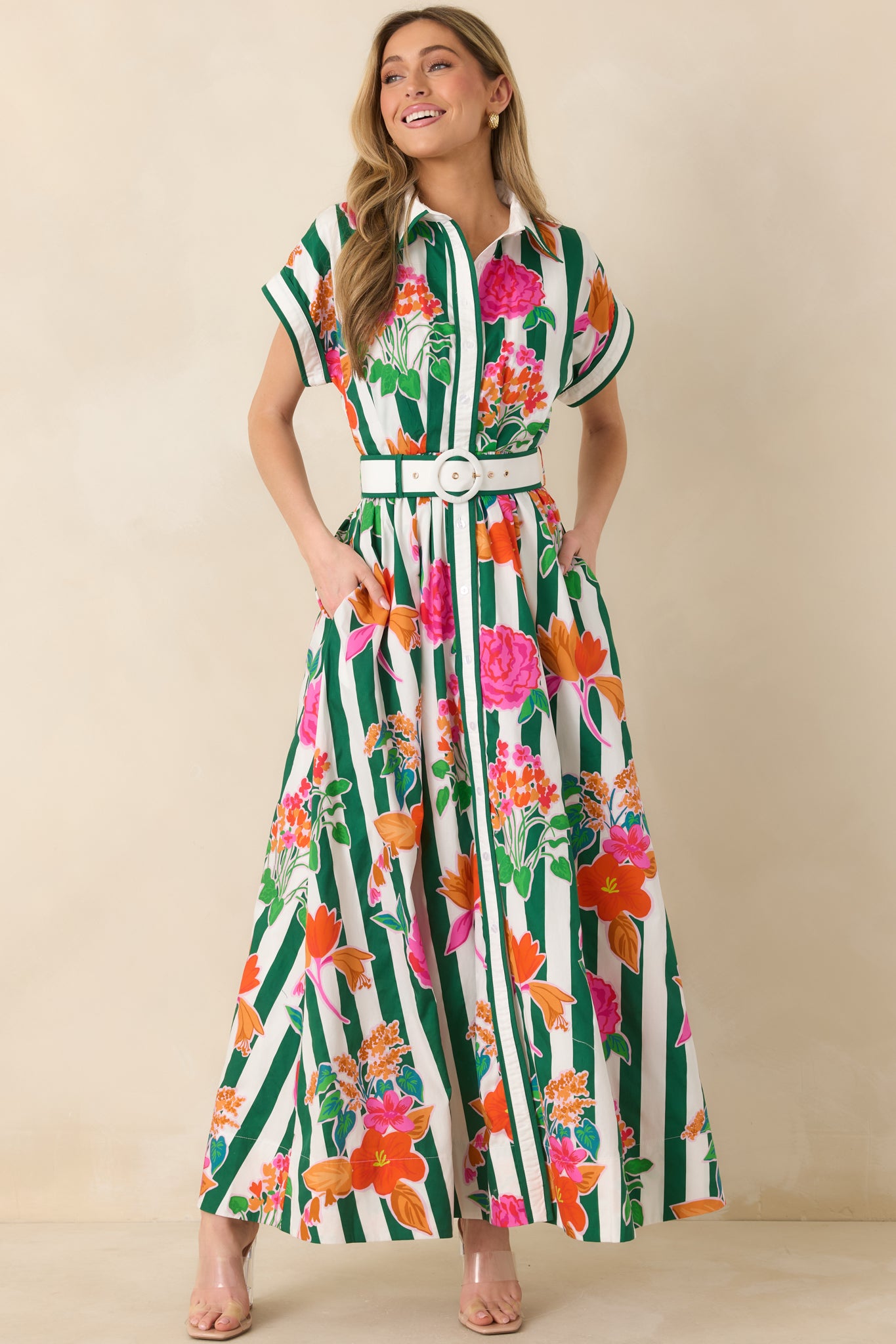 Floral stripe maxi dress featuring green vertical stripes, colorful blooms, a collared neckline, and adjustable waist tie belt.