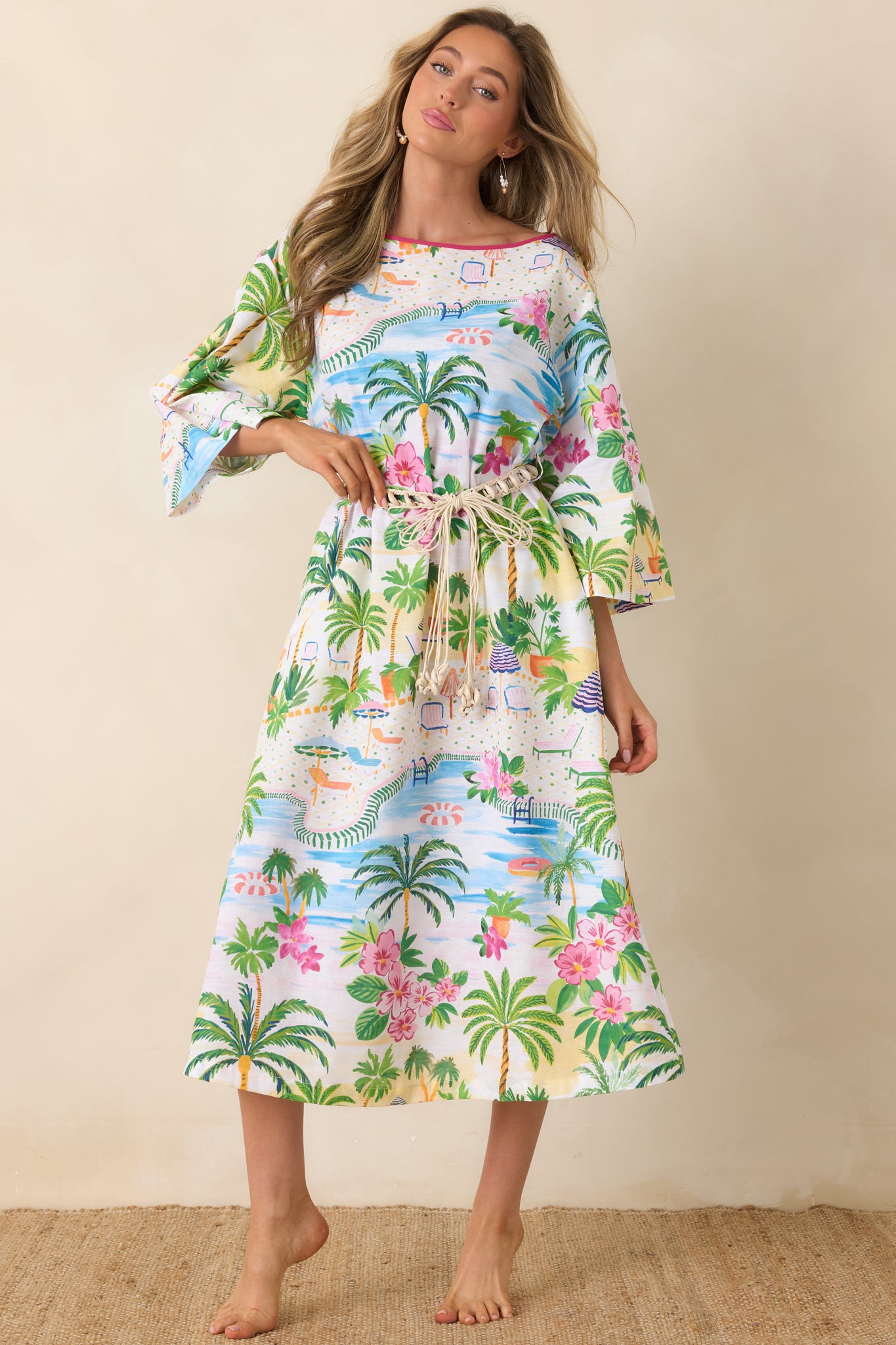 Relaxed silhouette caftan with bright pink contrast neckline and flowing sleeves.