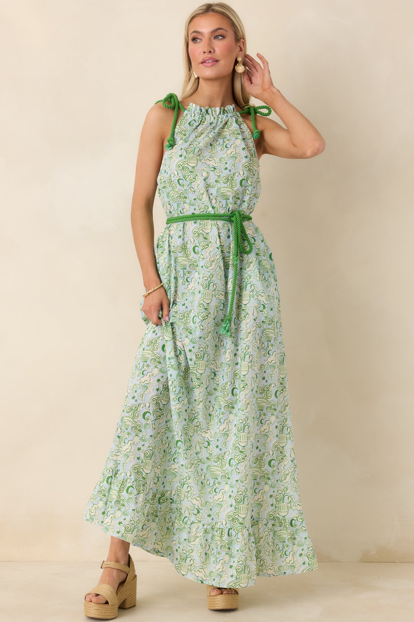 Sleeveless blue and green maxi dress featuring a mermaid-inspired print, gathered neckline, and coordinating rope waist tie.