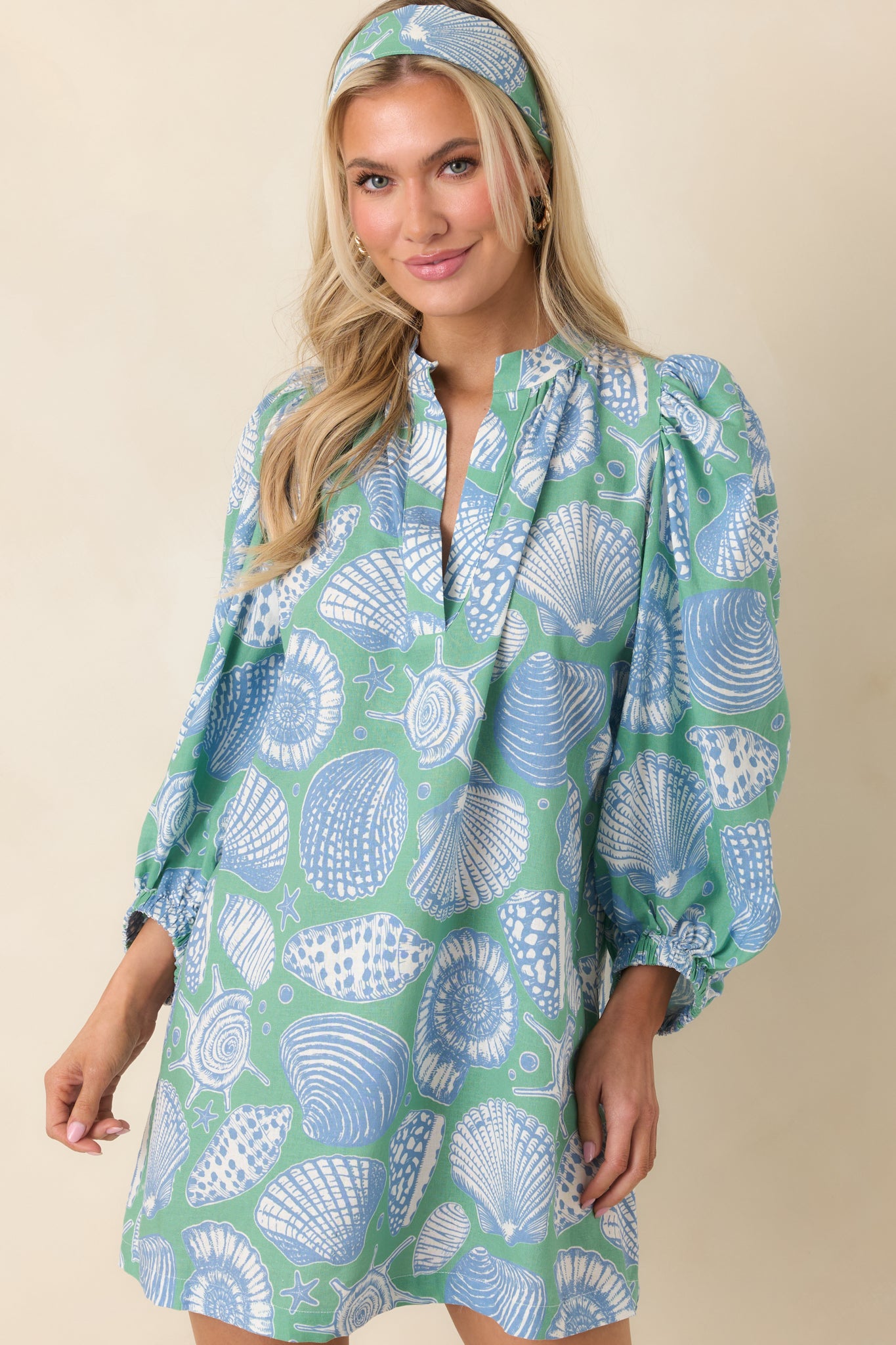 Puff sleeve detail with elastic cuff on lightweight green multi dress.