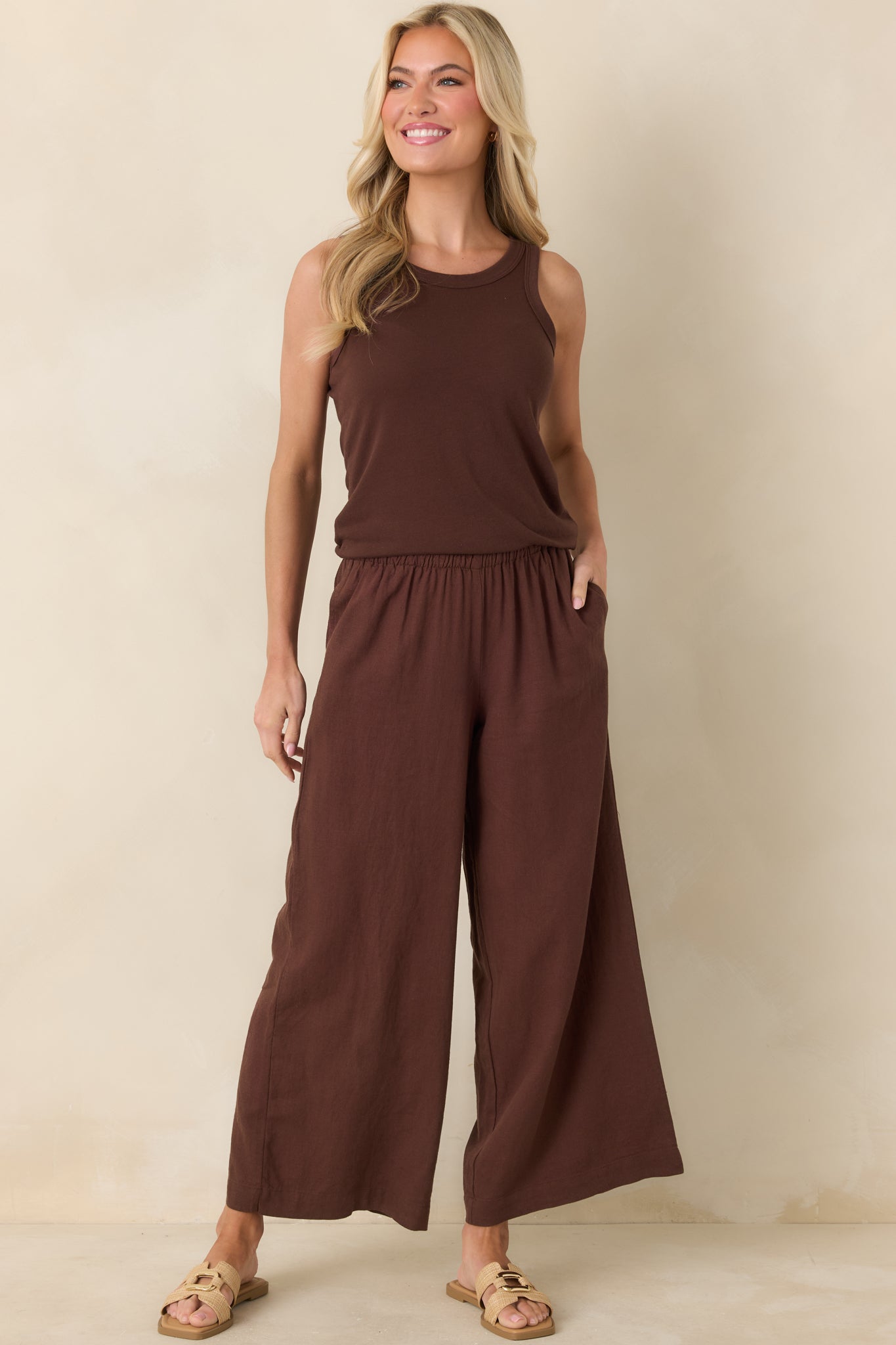Full-length front shot highlighting fluid wide-leg design and deep chocolate tone in lightweight linen fabric.