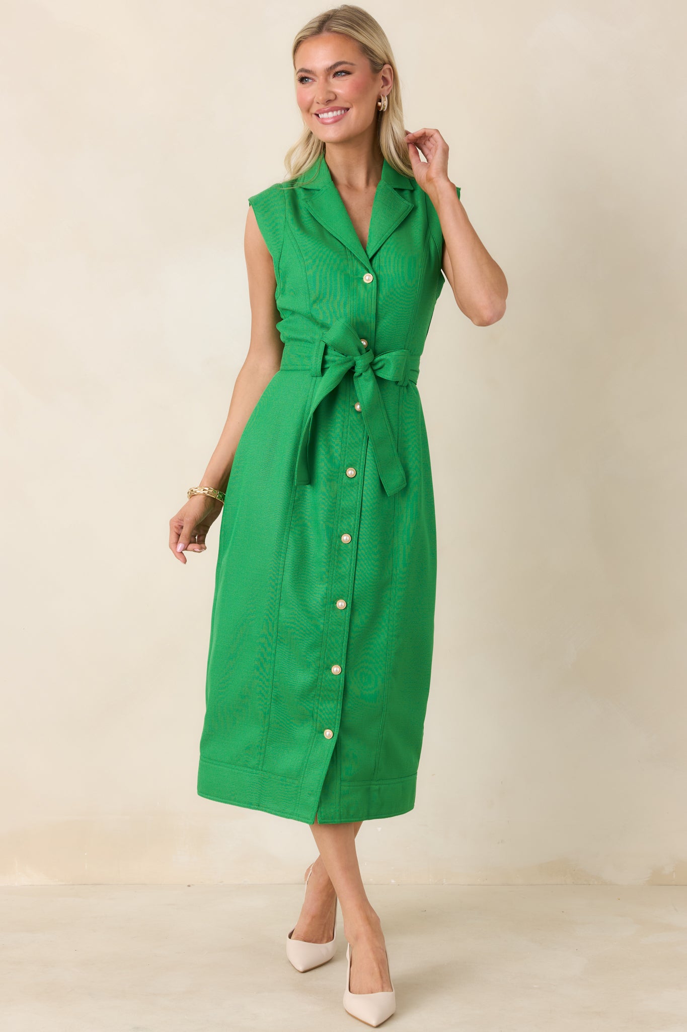 Full-length view highlighting removable self-tie belt and streamlined midi-length silhouette.