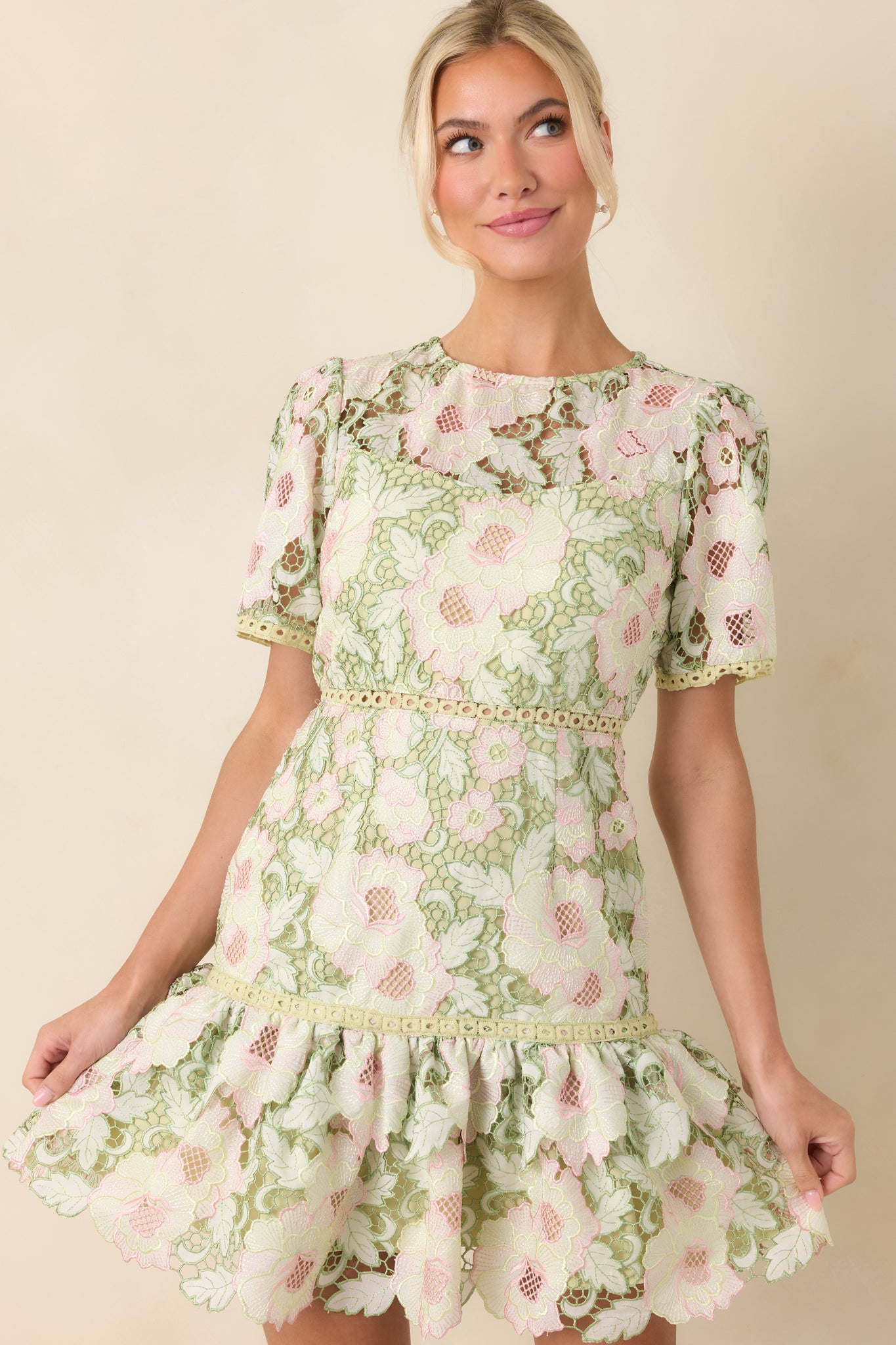 Closer look at the intricate green lace overlay with soft pink floral detailing and the smooth coordinating lining beneath.