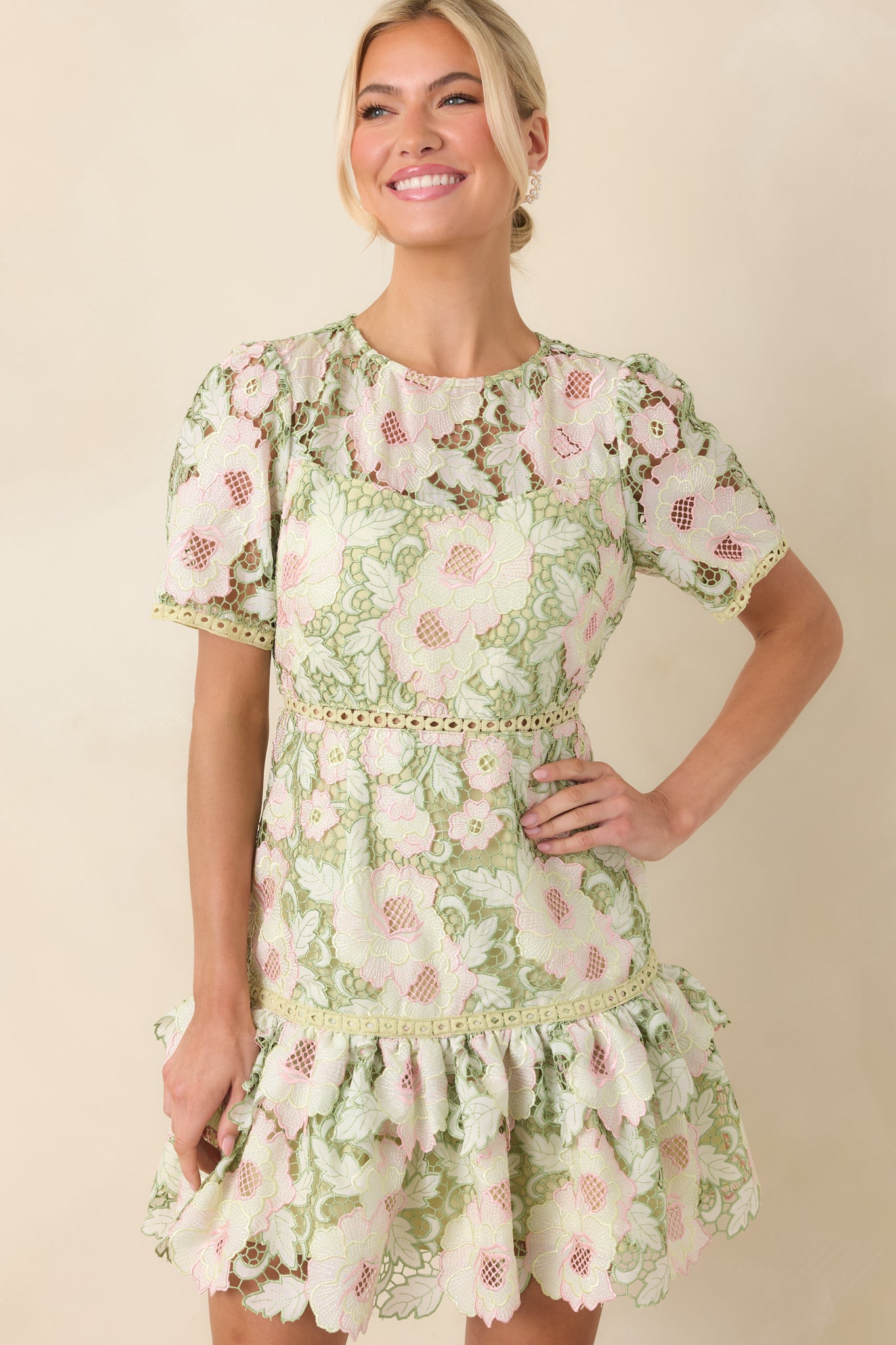 Short sleeve detail in intricate lace, showing the delicate floral pattern and refined stitching.