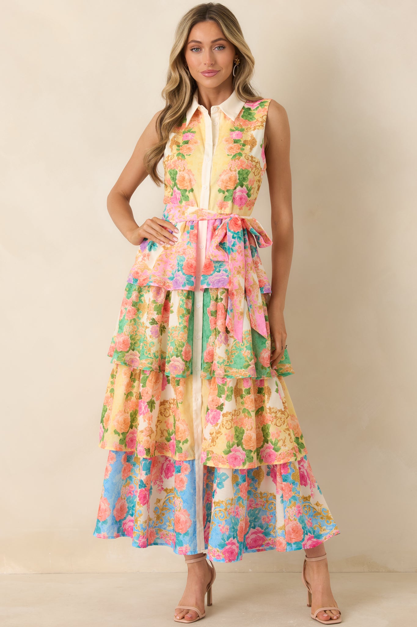 Structured collared midi dress featuring colorful floral print and flattering waist tie.