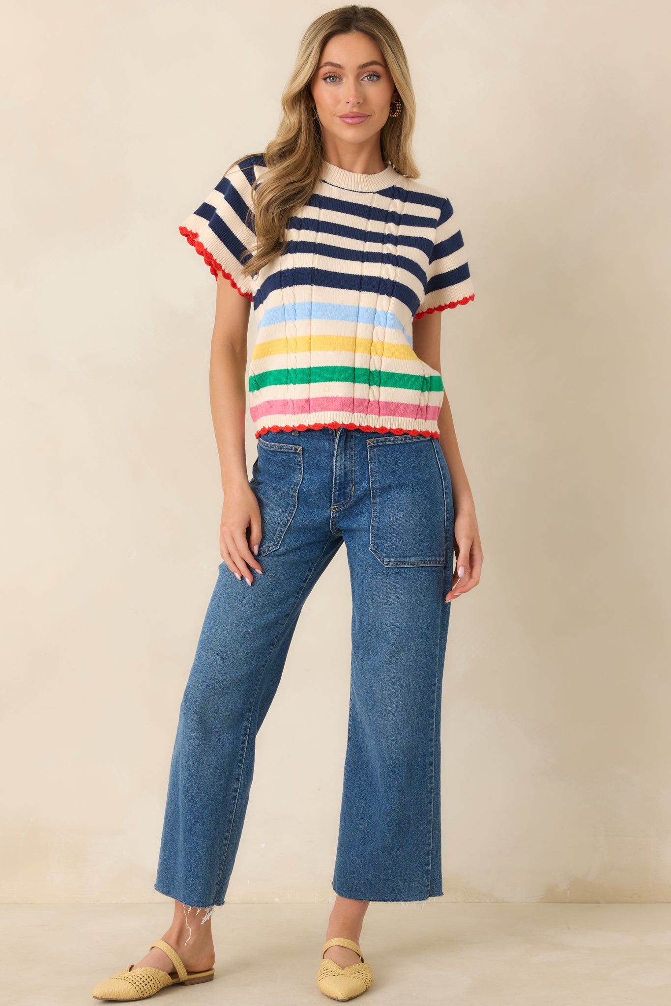 Relaxed knit top with classic navy stripes and playful colorful details.