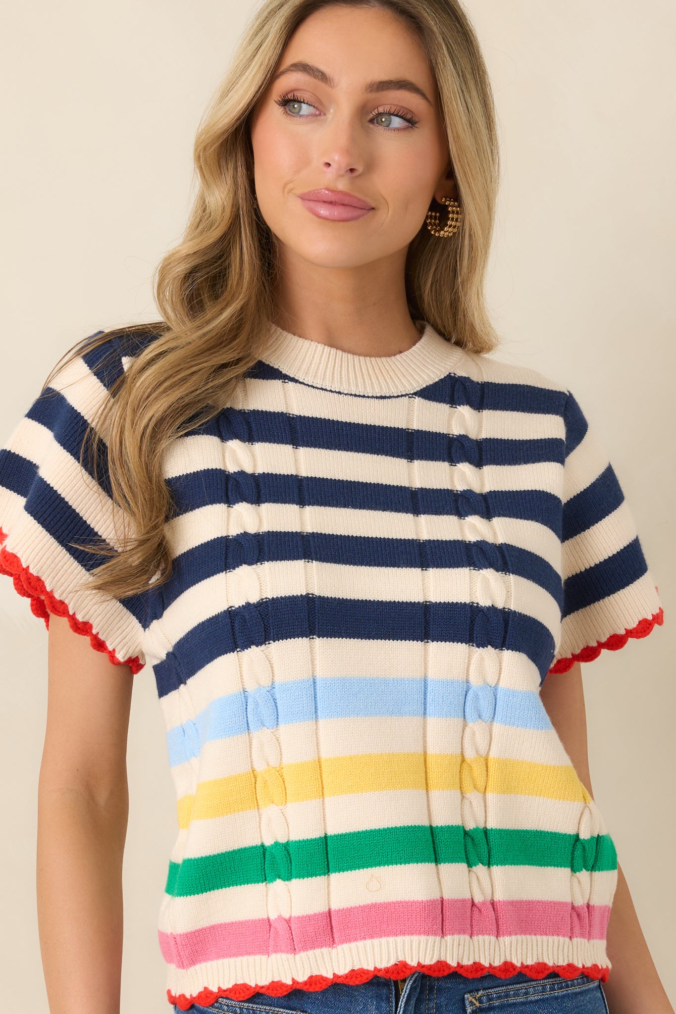 Textured knit with navy stripes and vibrant pops of color.
