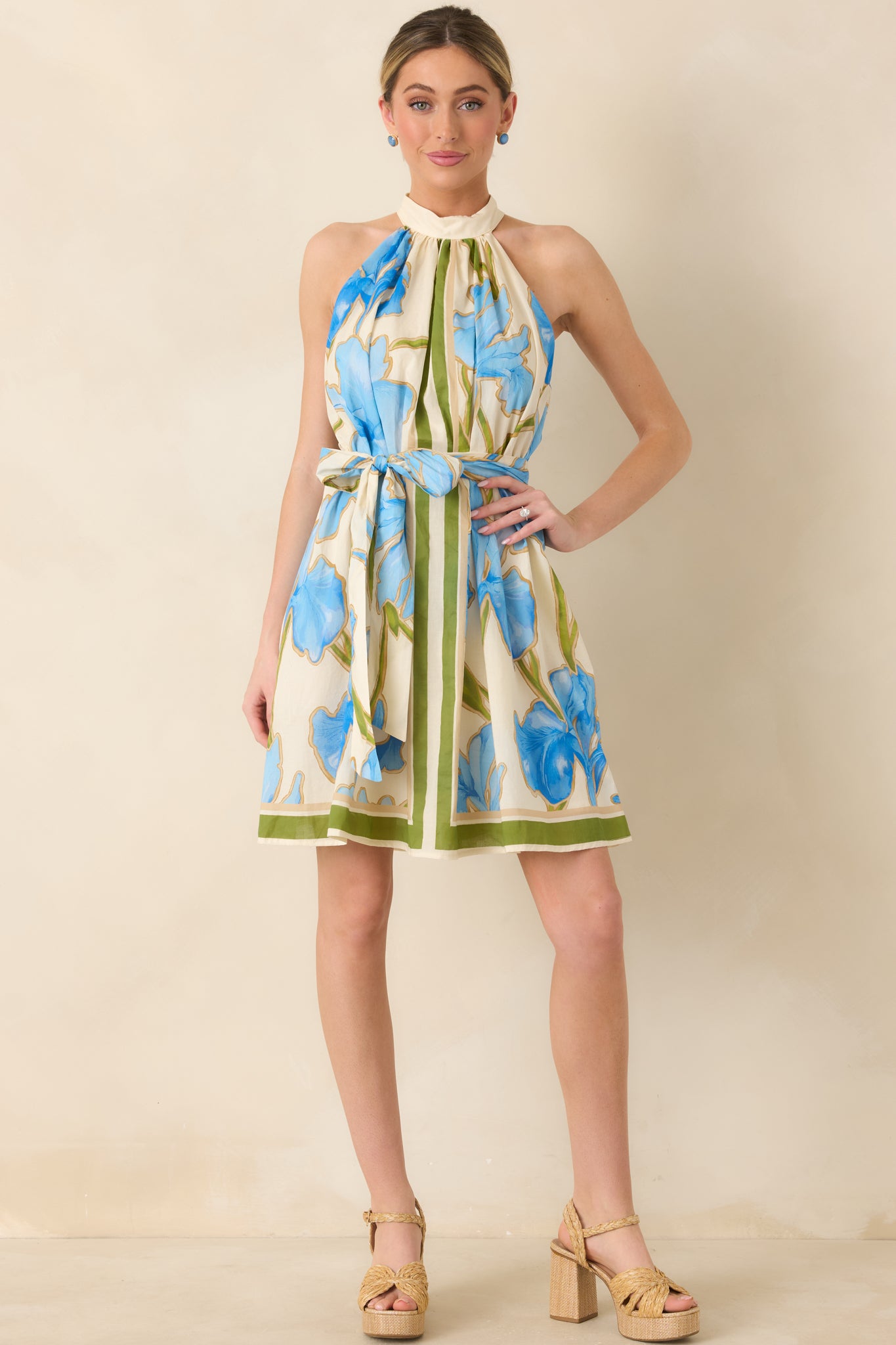 Halter-neck dress featuring a self-tie waist belt and breezy skirt.