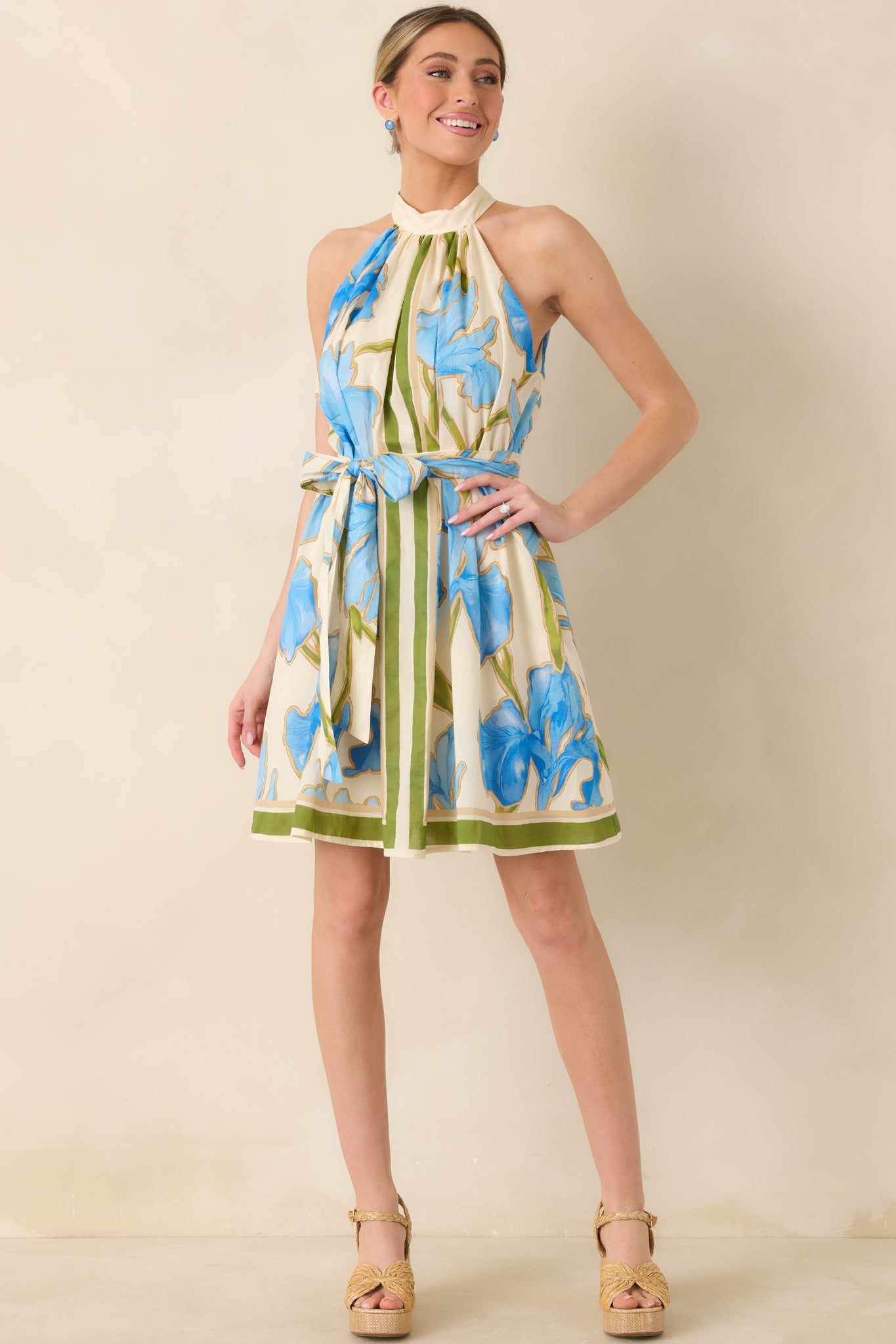 Lightweight mini dress with striking floral pattern and flattering silhouette.