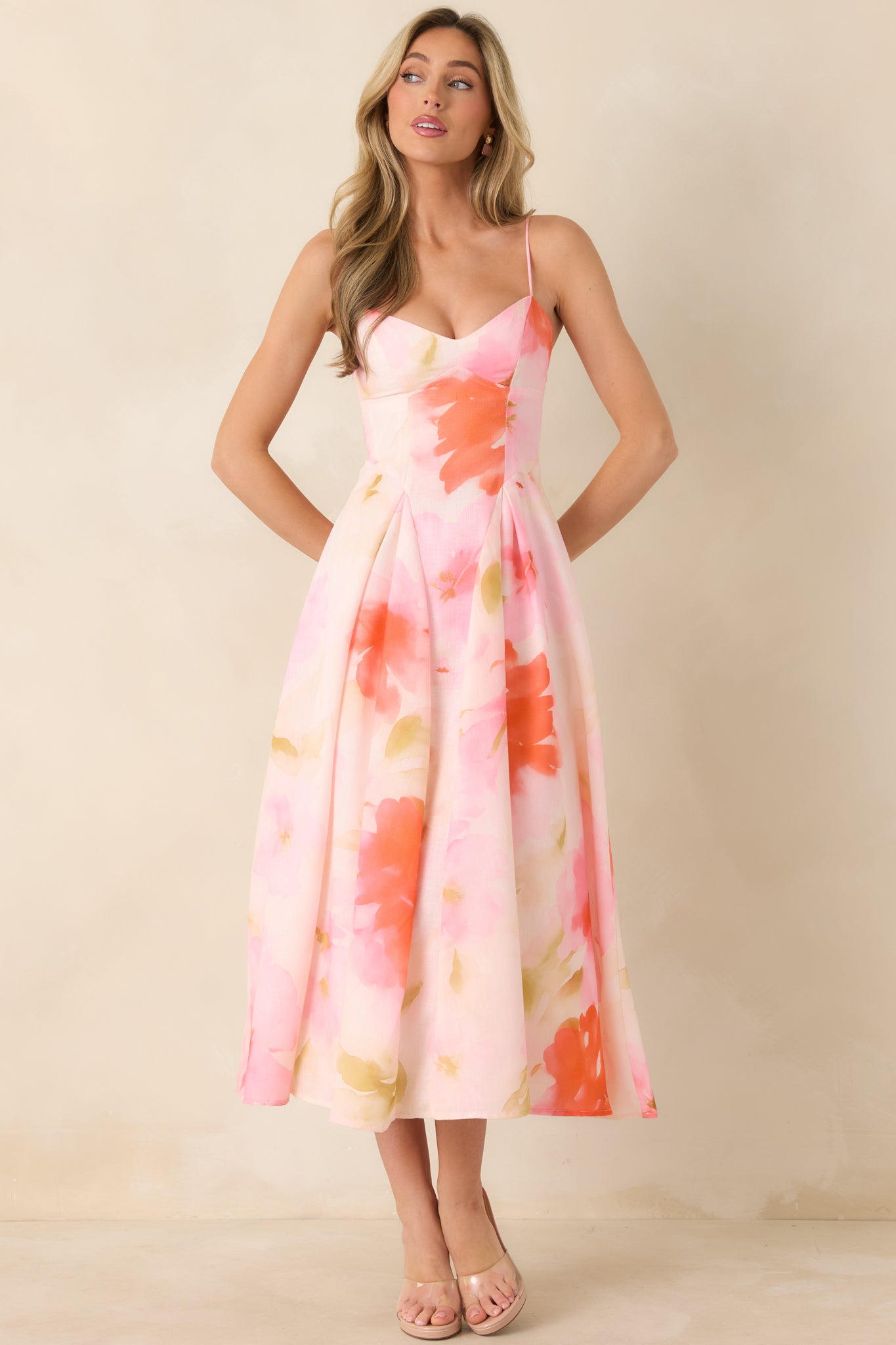 Lightweight woven midi dress with sweetheart-style neckline and softly draped A-line skirt.