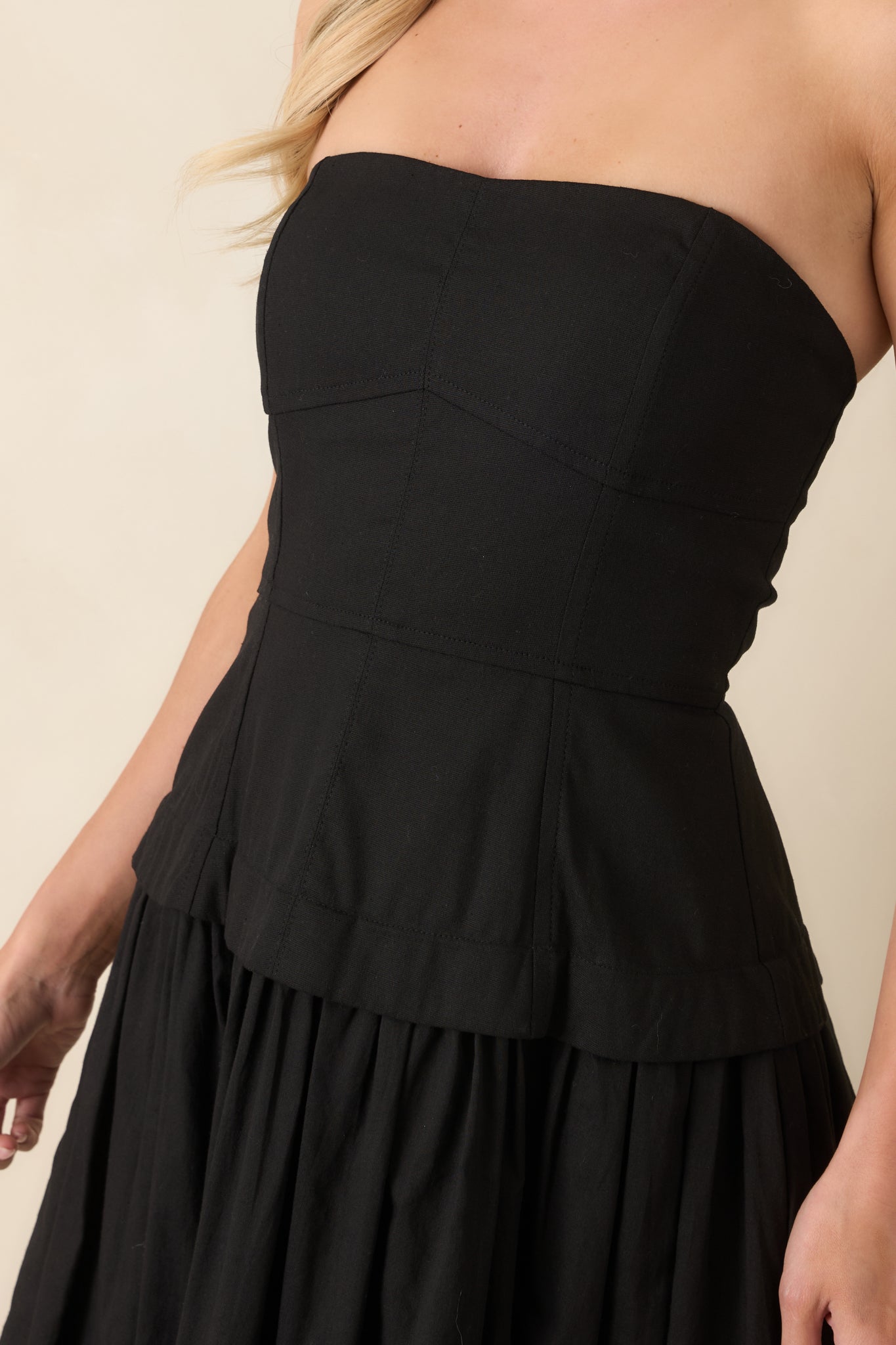 Detailed close-up of the bodice paneling, stitching, and smooth fabric finish.