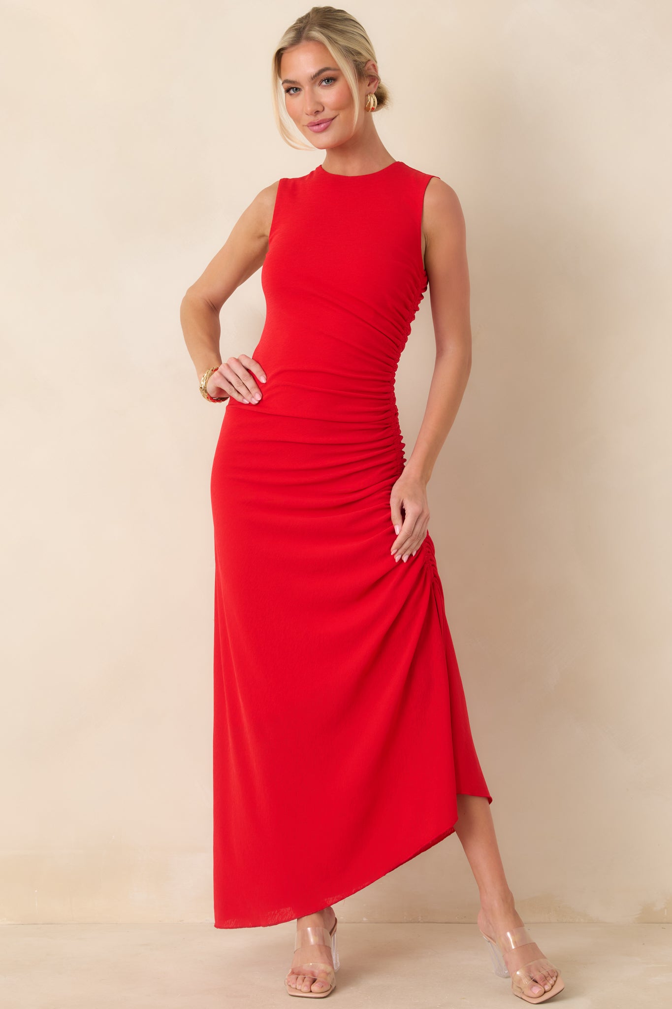 Red midi dress with a round neckline and sleeveless design, featuring adjustable side drawstring ruching for a customizable, figure-flattering fit.