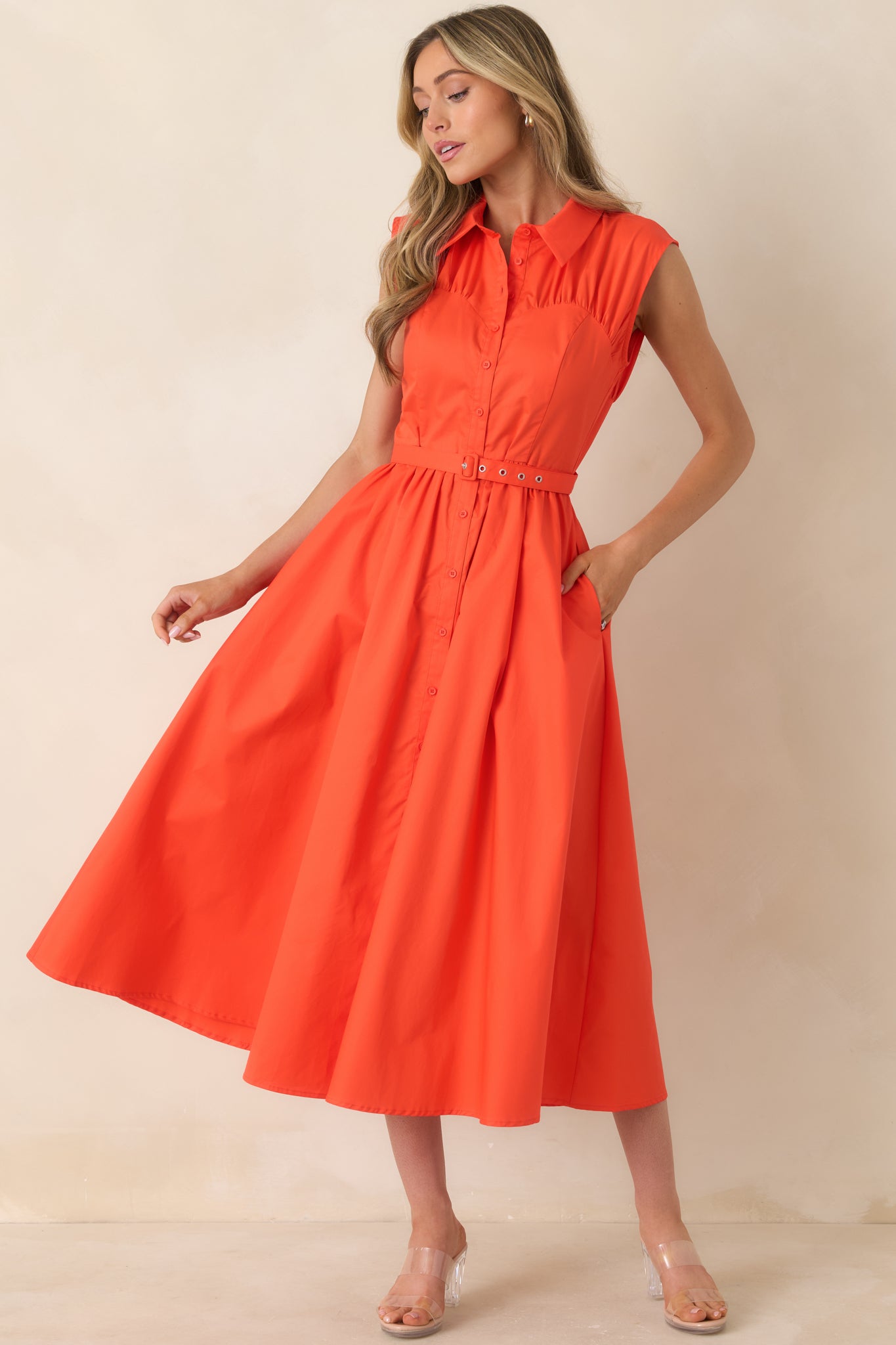 Cotton midi dress with collared neckline, button-front design, coordinating belt, and full skirt.