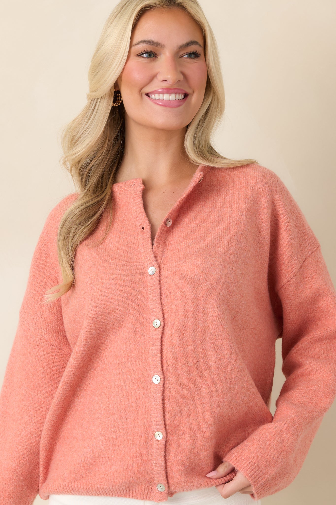 Detailed look at the ribbed cuffs and hem, emphasizing the clean finishing and soft knit construction.