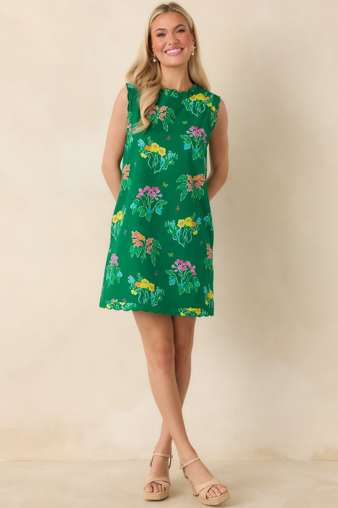 Cotton mini featuring scalloped neckline and hem, with light and breezy design.