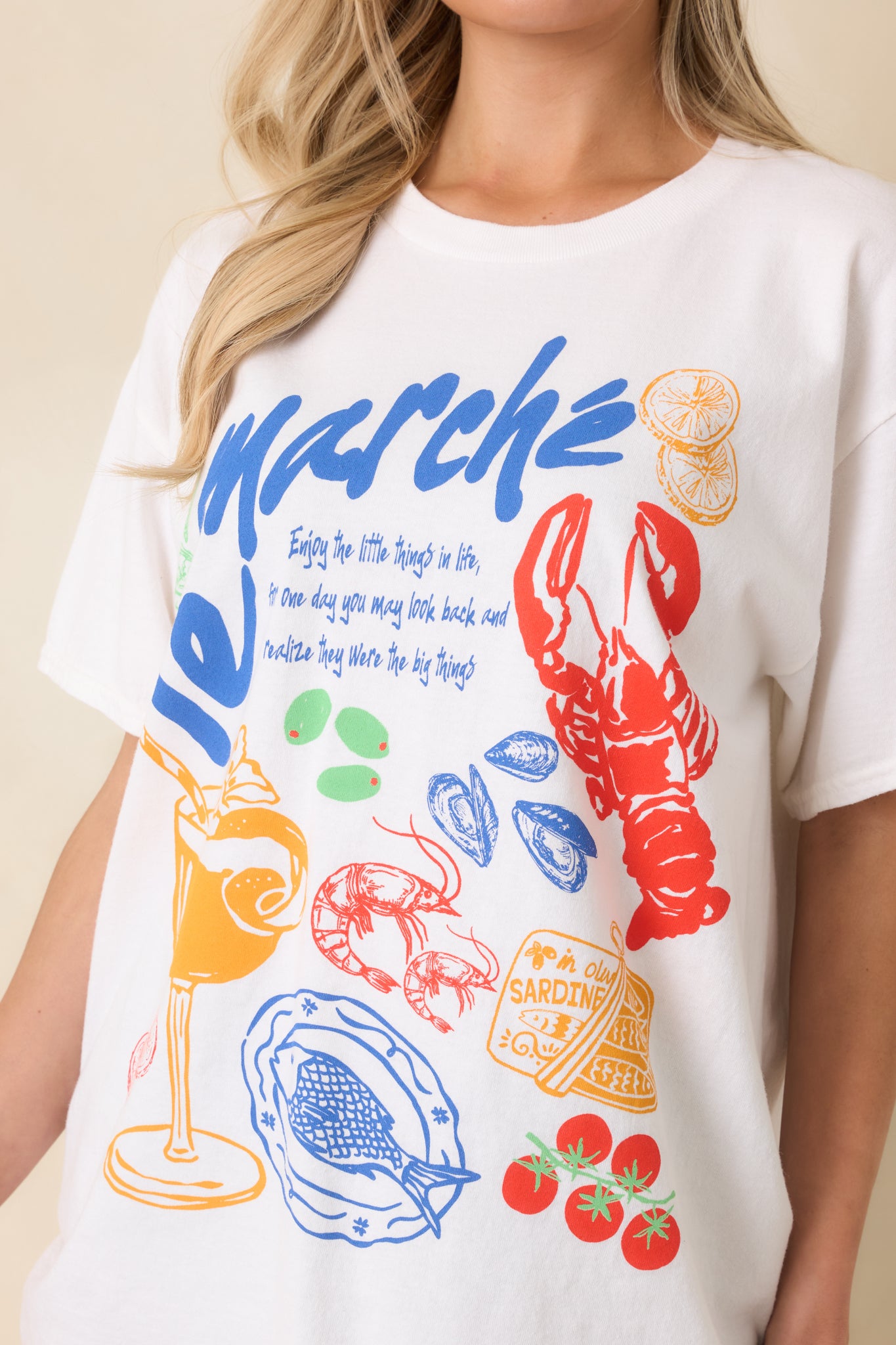Close look at the multicolor coastal Europe-inspired graphic and lightweight cotton weave of the tee.