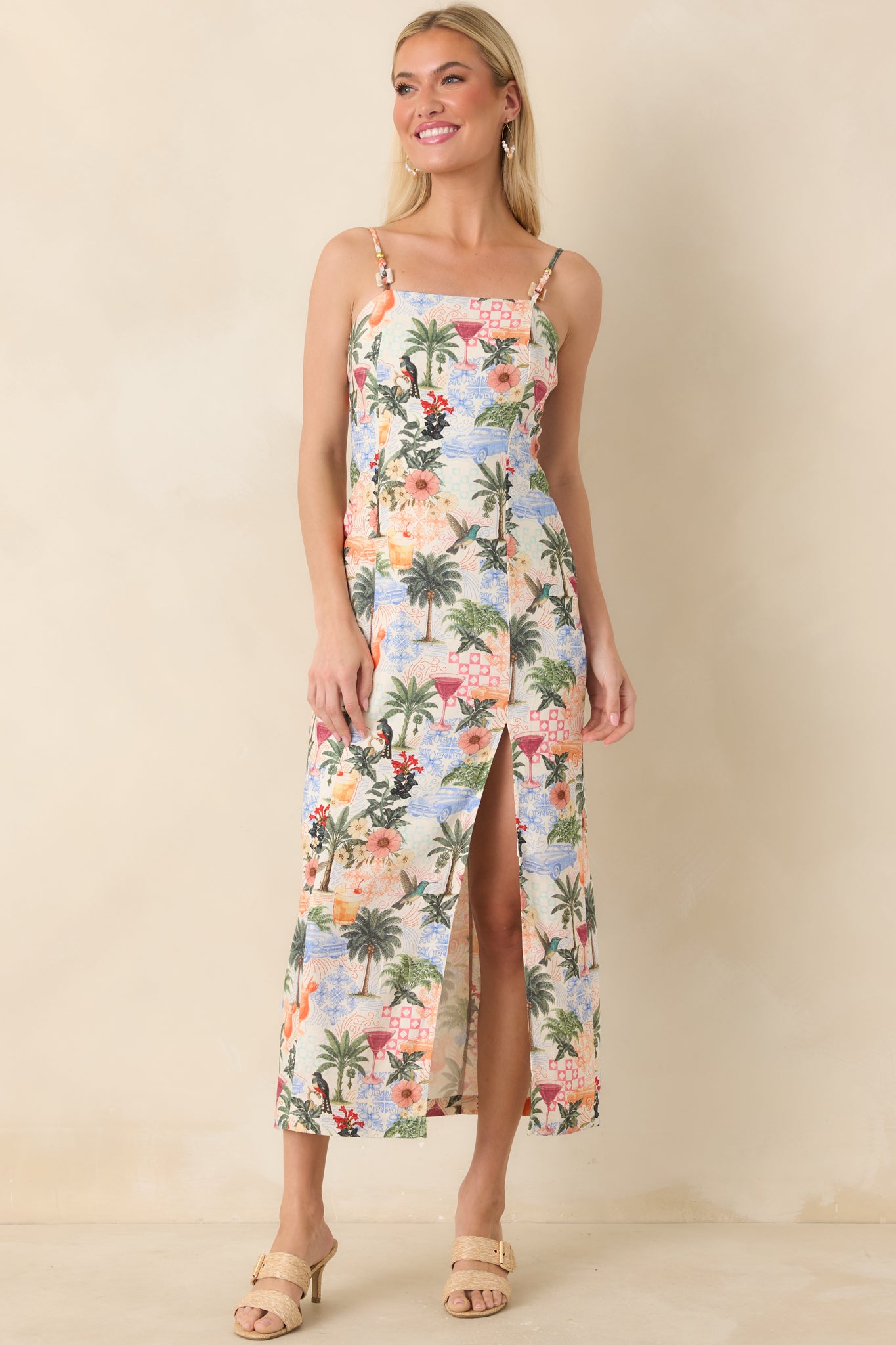 Playful, tropical midi dress featuring vintage-inspired motifs and feminine shape.