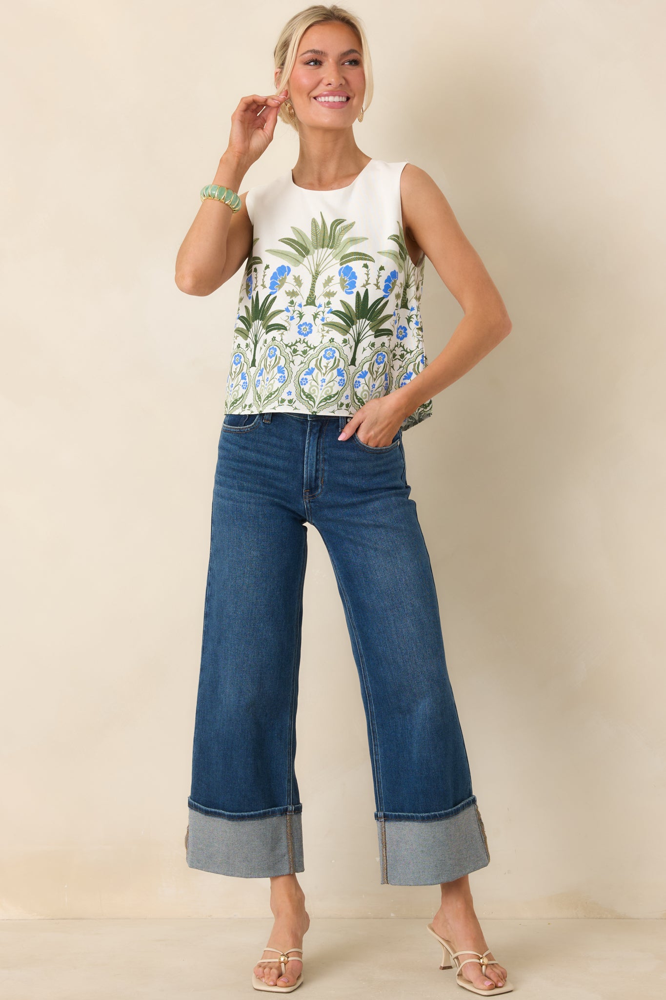 Cropped, boxy ivory top featuring a colorful floral print and clean round neckline.