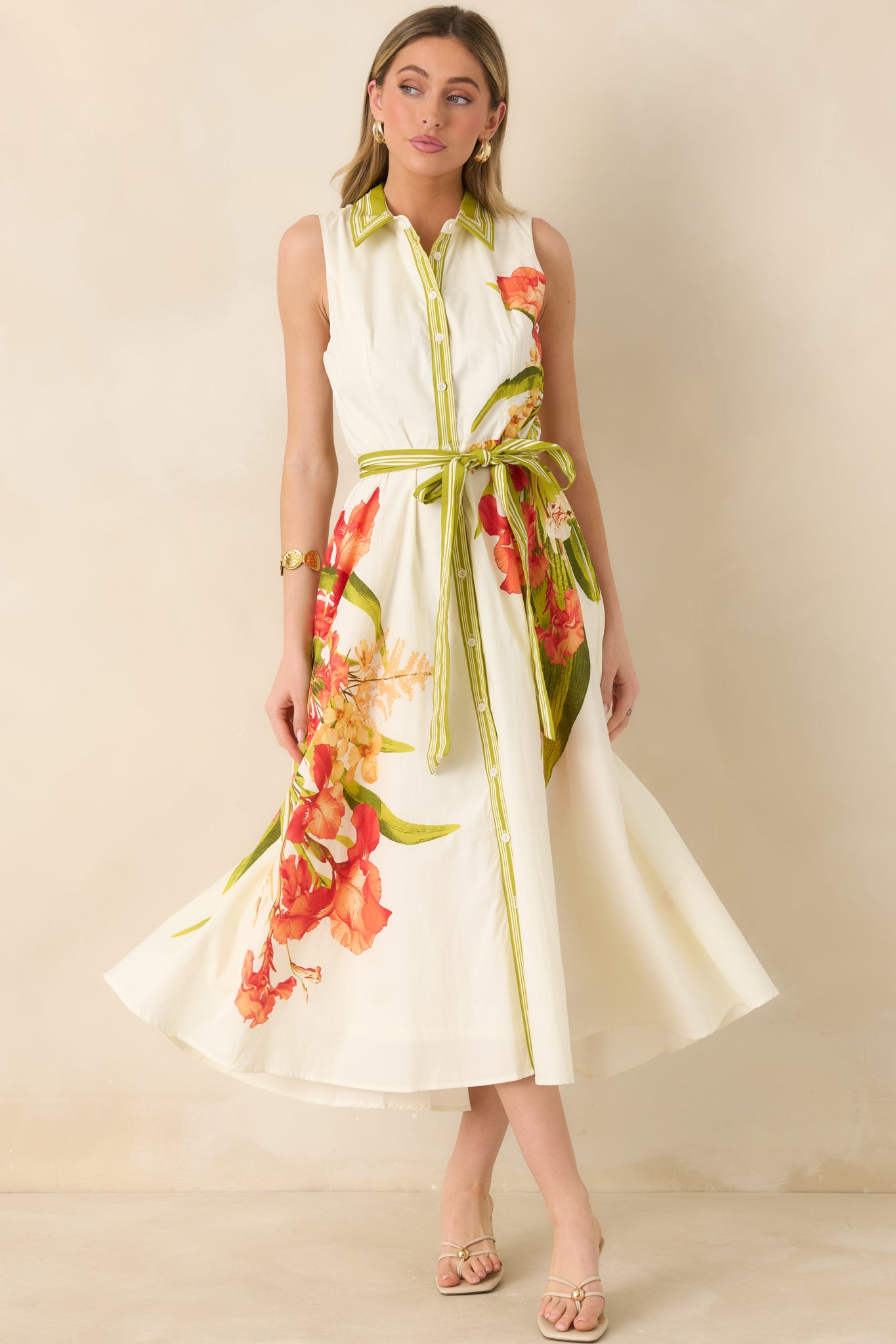 Breezy sleeveless maxi dress with adjustable tie belt and soft movement.
